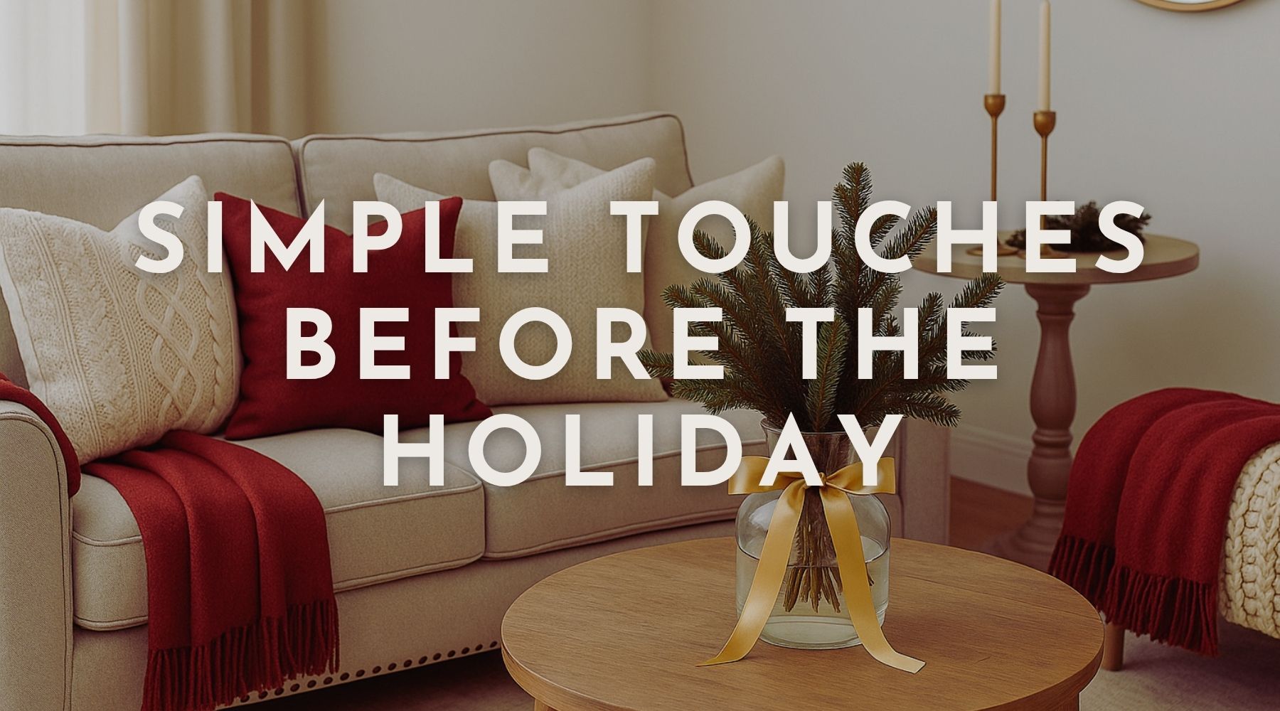 Cozy neutral living room with red pillows, gold ribbon accents, and warm winter decor that welcomes the holiday season.