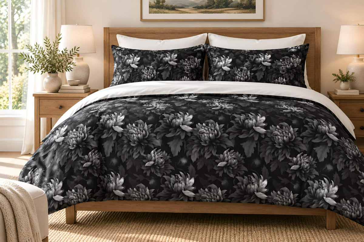 Midnight Dahlia black floral duvet cover with matching shams in a bright ivory bedroom with oak furniture.