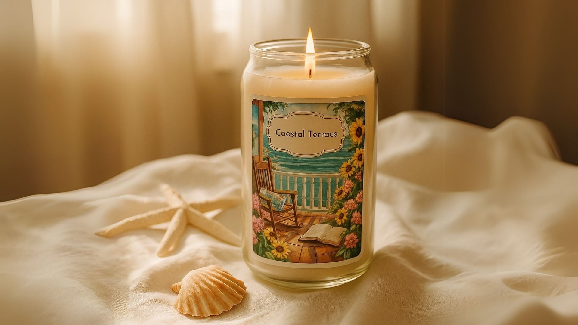 Soy candle flickering near a sunlit window and on a table with seashells.