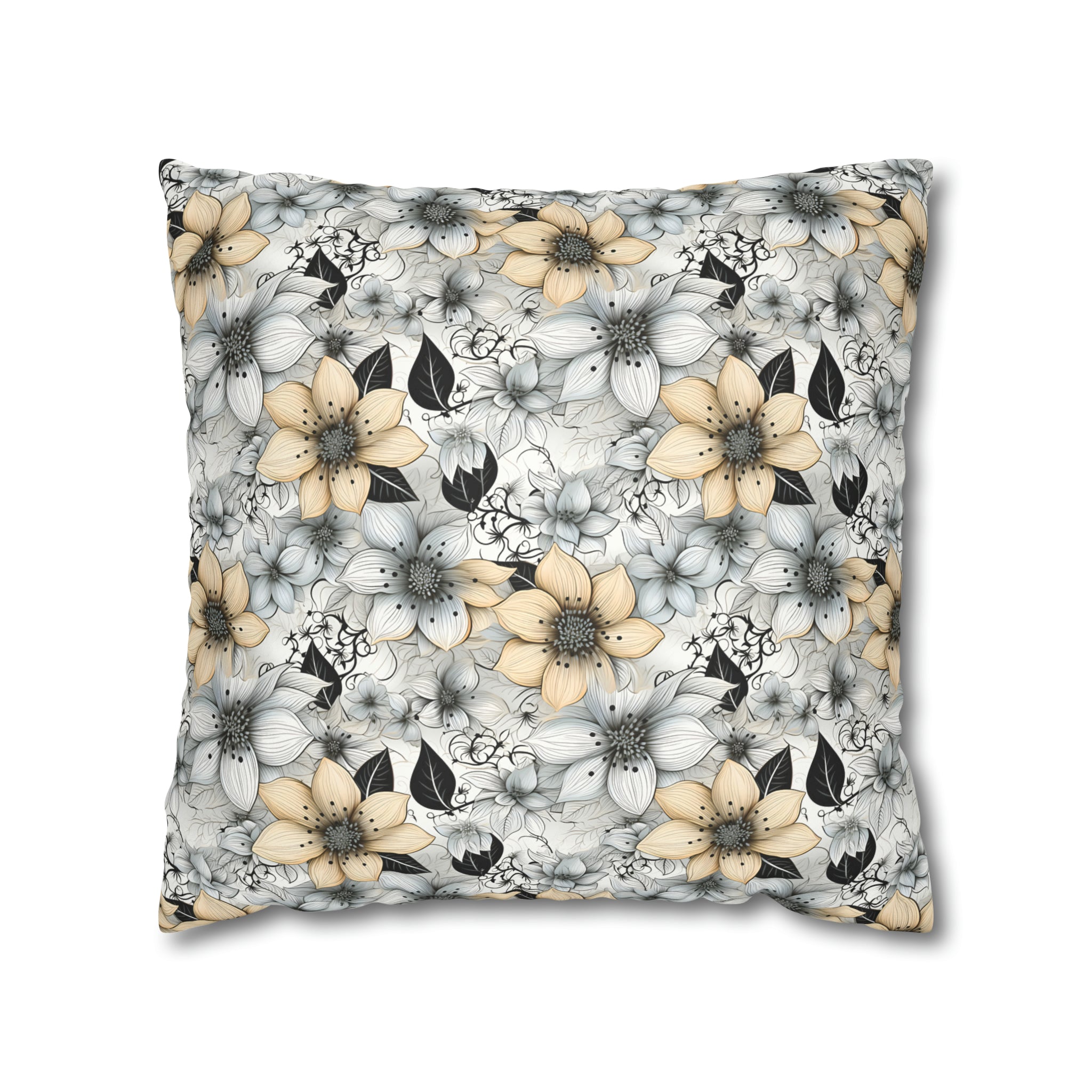A square-shaped pillow with a floral pattern consisting of predominantly white and beige flowers and darker leaves on a faux suede fabric.