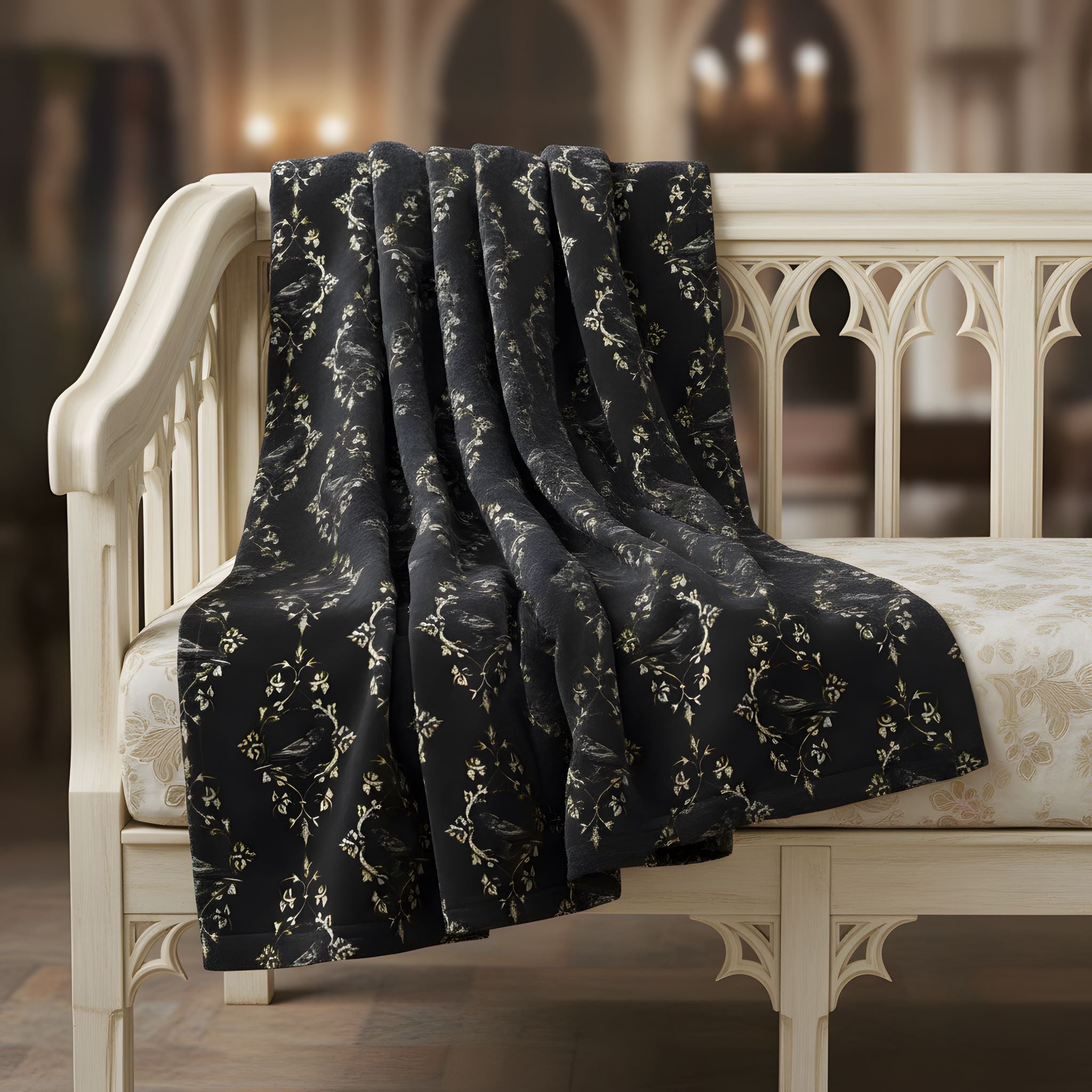 Black Raven throw blanket styled on a white chair in a moody Victorian-inspired room.