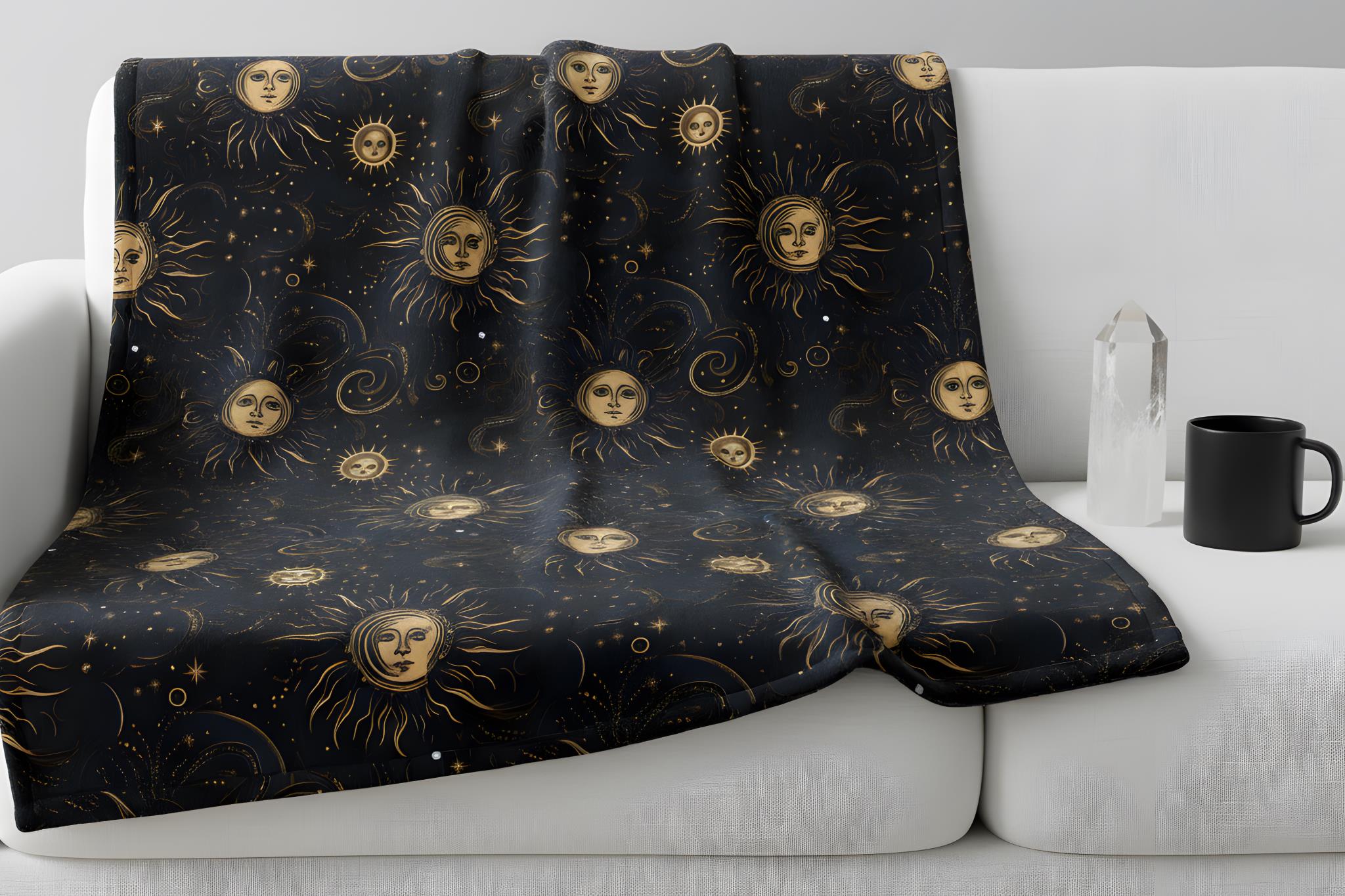 A golden celestial blanket daraped over a white couch with whimsigoth decor.
