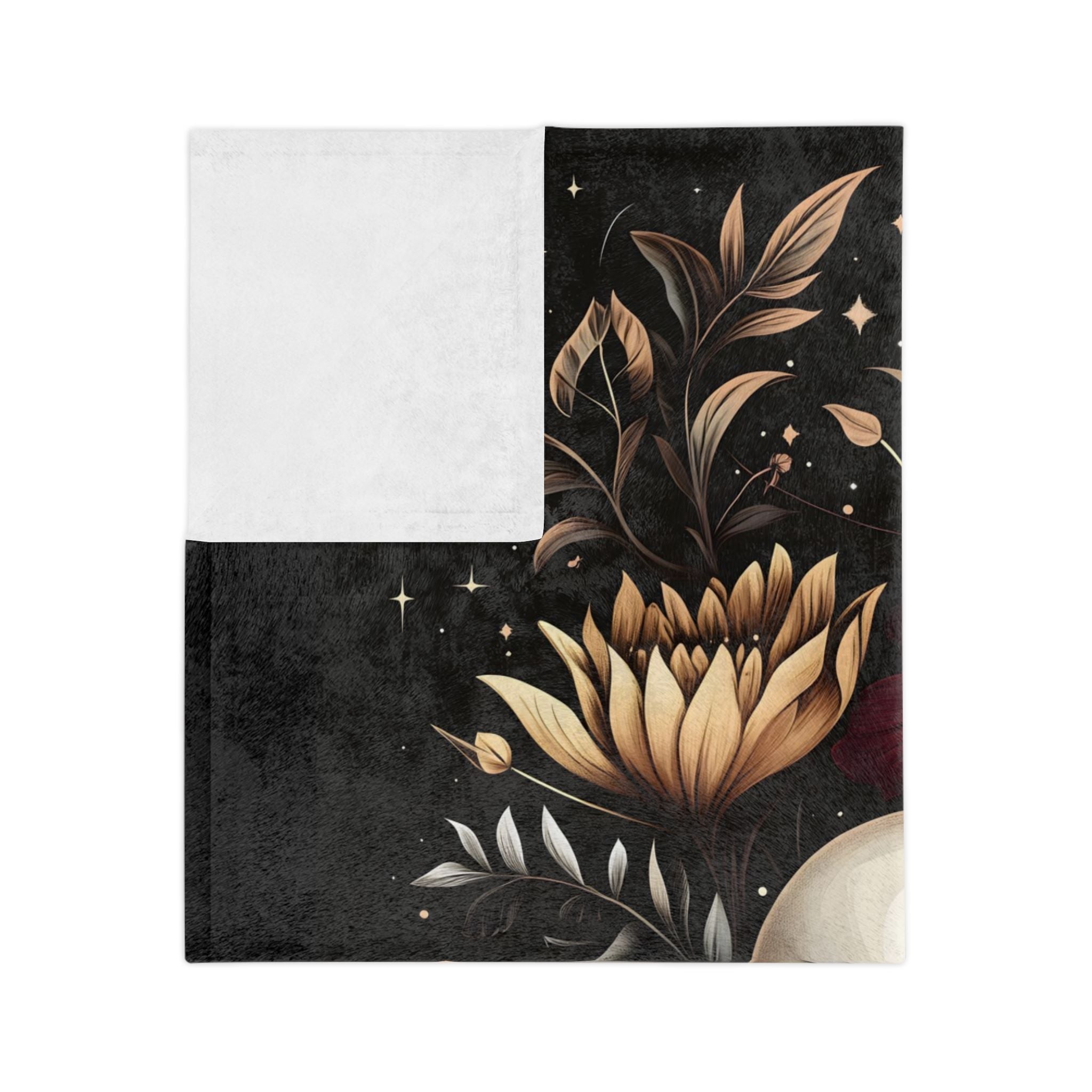 Folded Dark ivory floral velveteen throw blanket showing white underside.