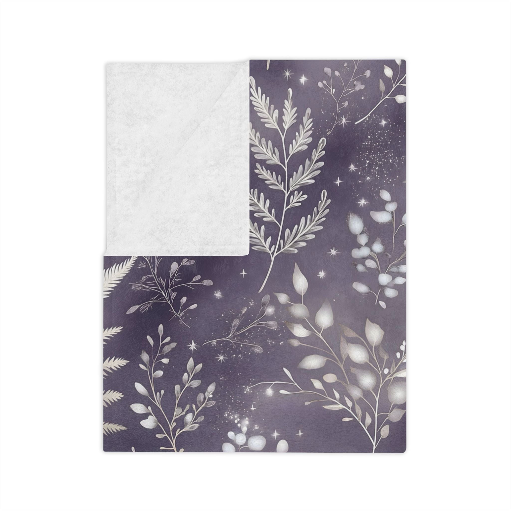 Folded Gothic velveteen throw blanket with celestial fern pattern in smoky violet and silver.
