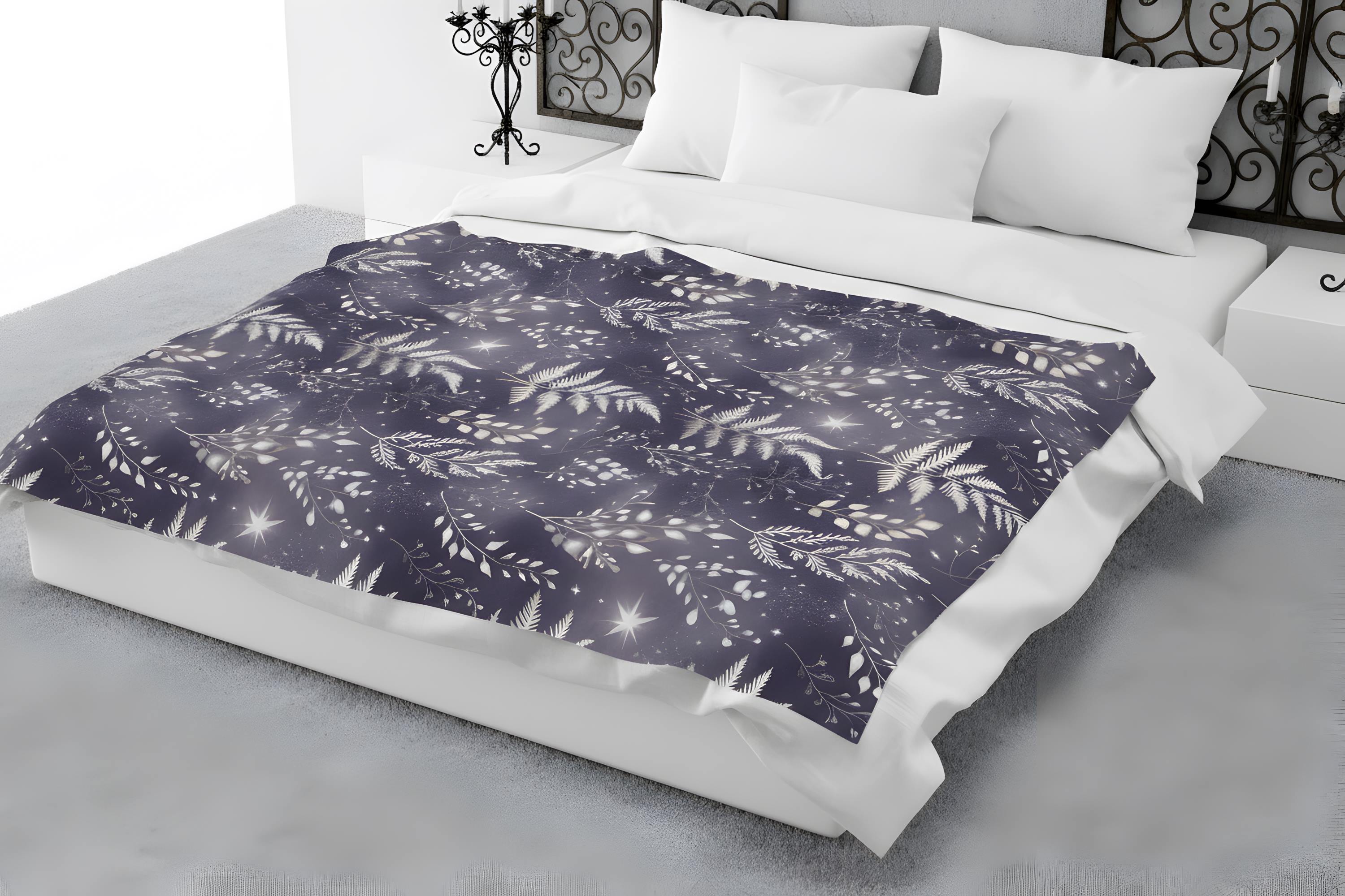 Gothic fern throw blanket layered on a bed with white pillows and moonlit botanical print.