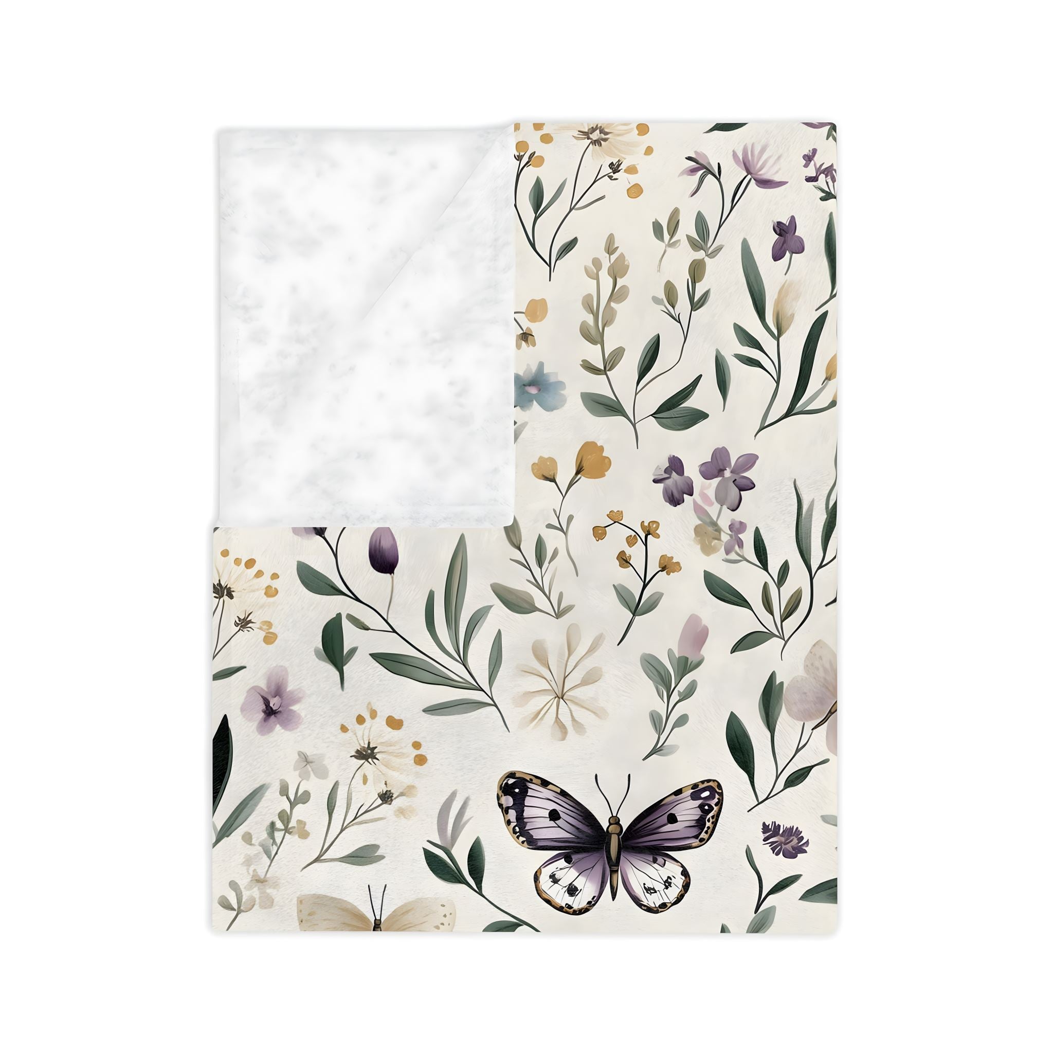 Folded butterfly floral throw blanket with cream background, lilac butterflies, and delicate cottage flowers.