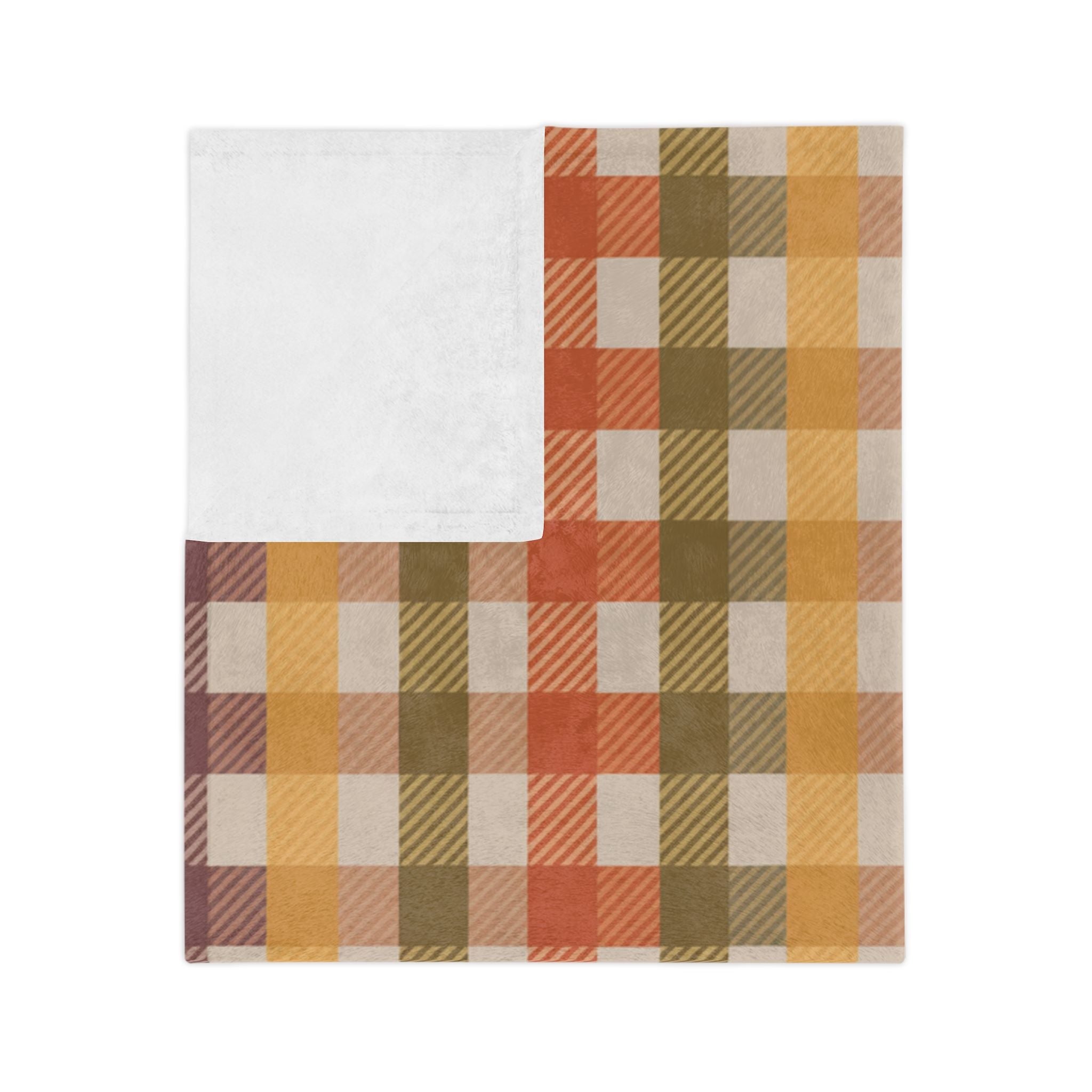 Folded rustic plaid throw blanket with mustard, sage, mauve, and terracotta tones with white backside.