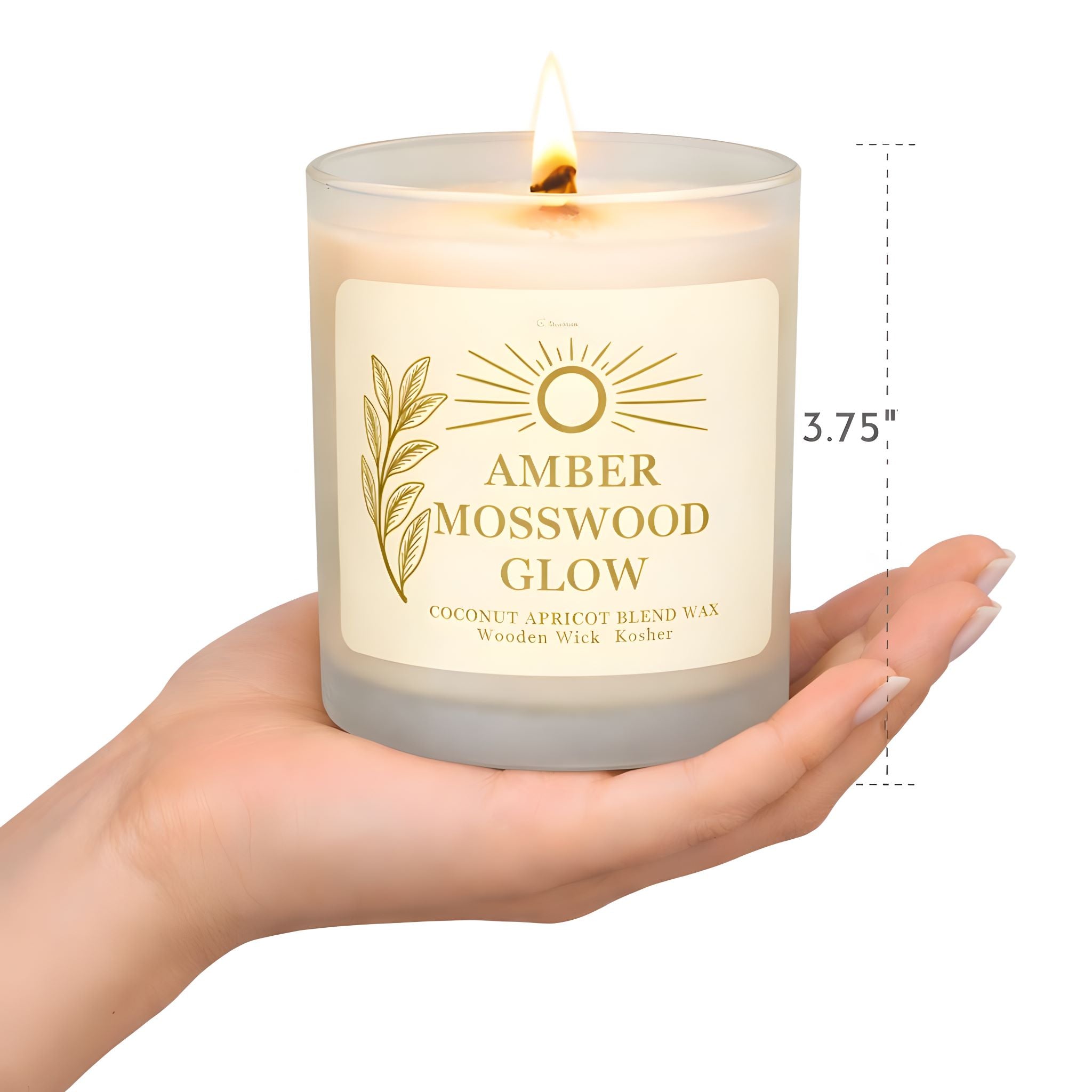 A person's hand holding the amber mosswood scented candle showing actual size.