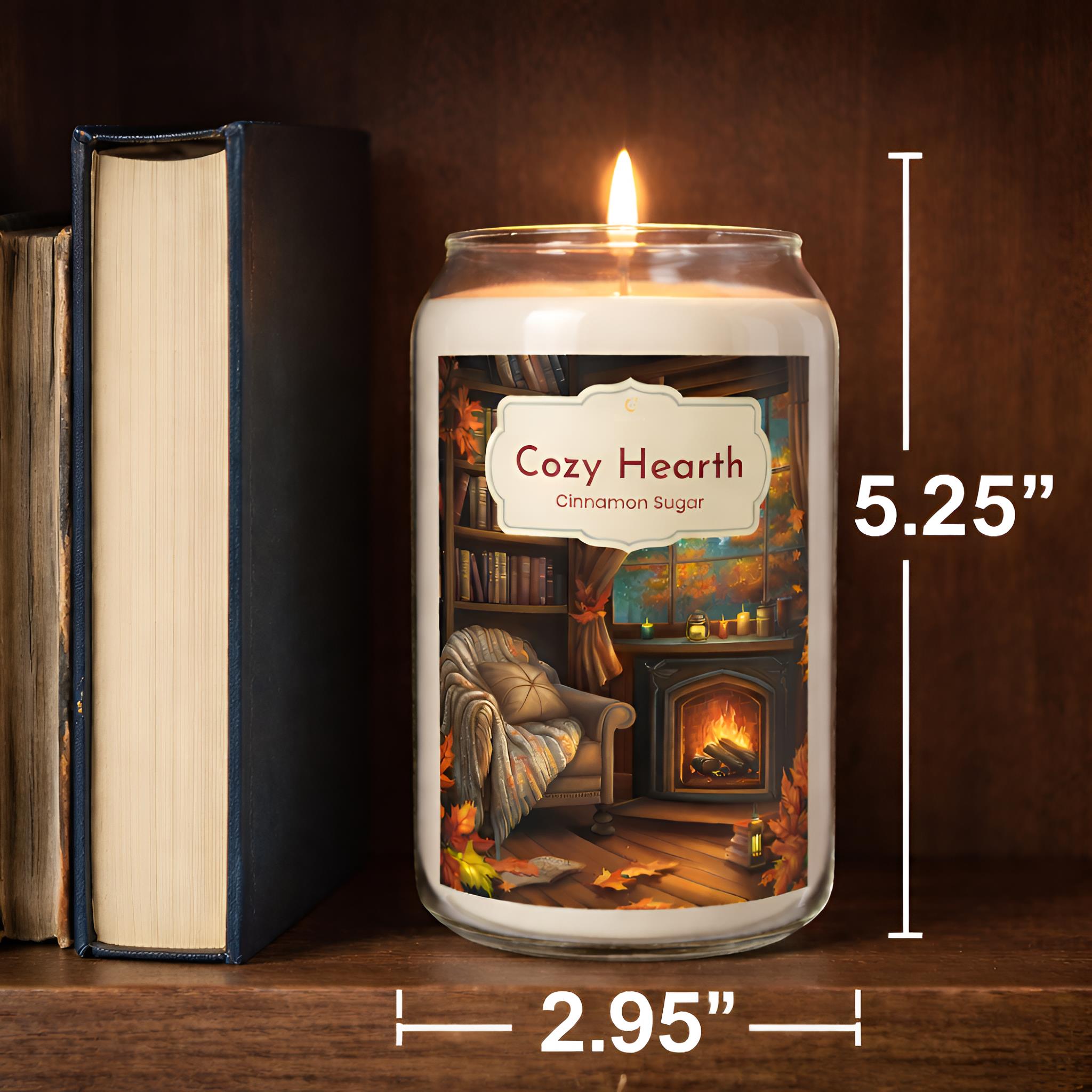Fall Cinnamon Scented Candle labeled 'Cozy Hearth' with dimensions and a book next to it on a wooden surface.