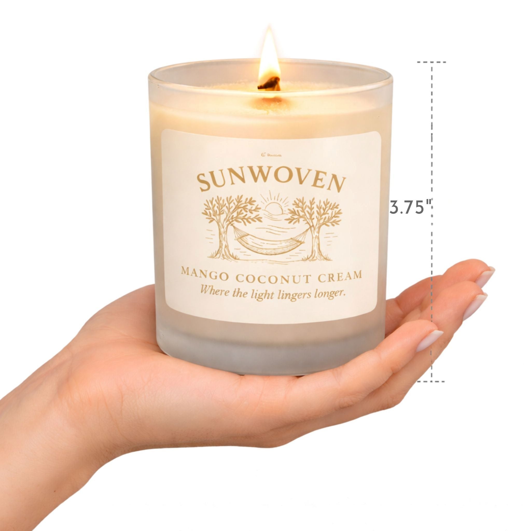 Mediterranean candle in mango coconut cream scent with wooden wick in person's hand showing actual size.
