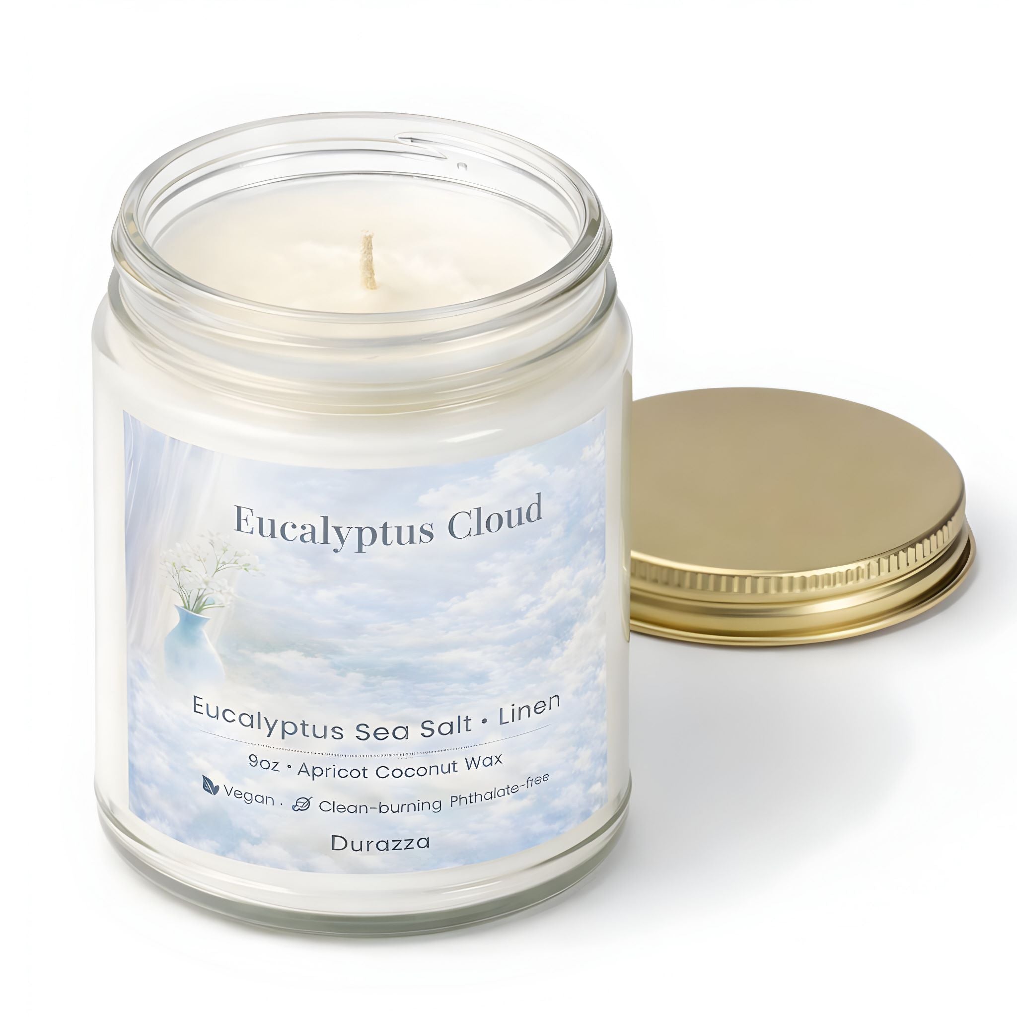 Eucalyptus and sea salt scented Candle in a jar labeled 'Eucalyptus Cloud' with a gold lid.