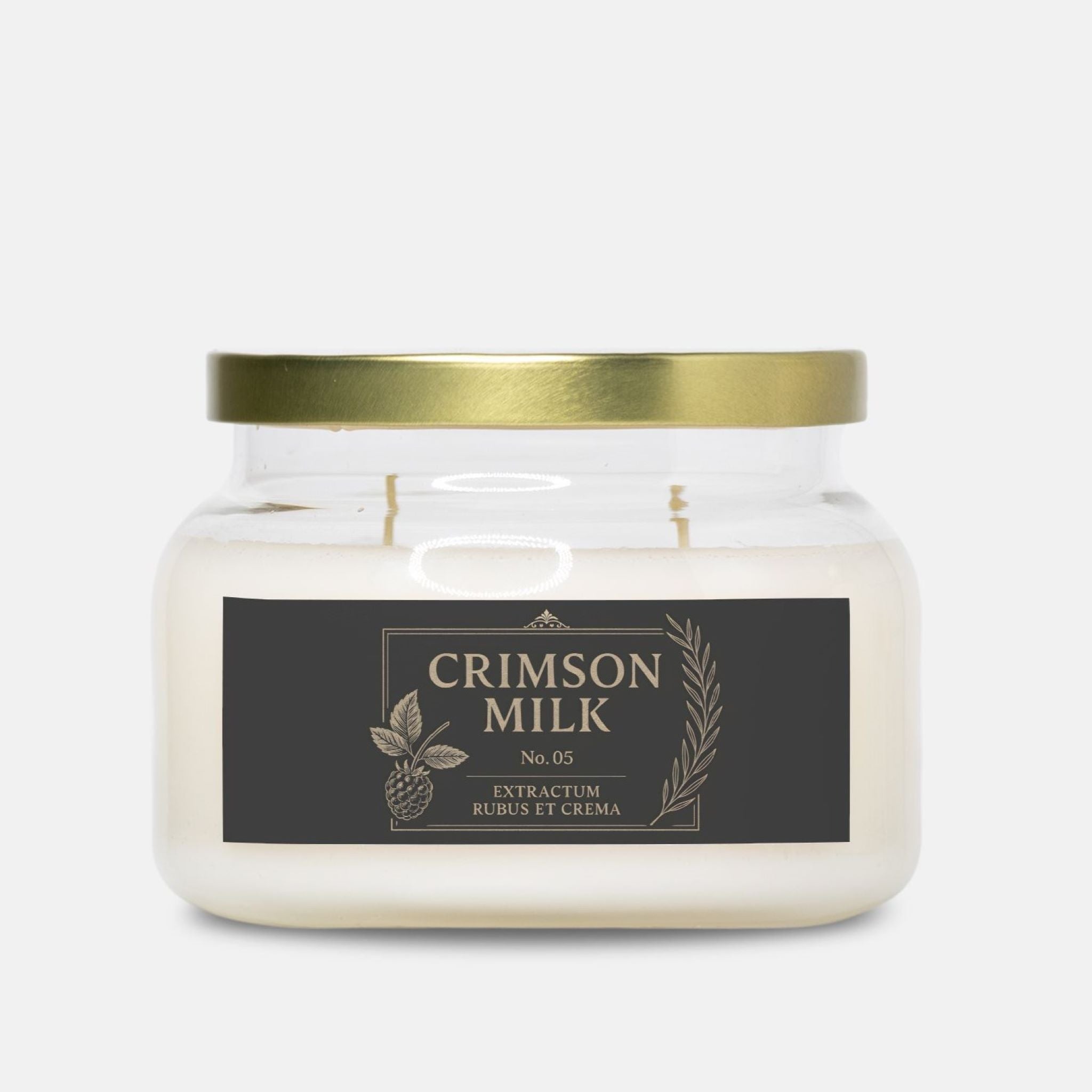 Eco-friendly scented jar candle with a gold lid and 'Crimson Milk' label on a white background