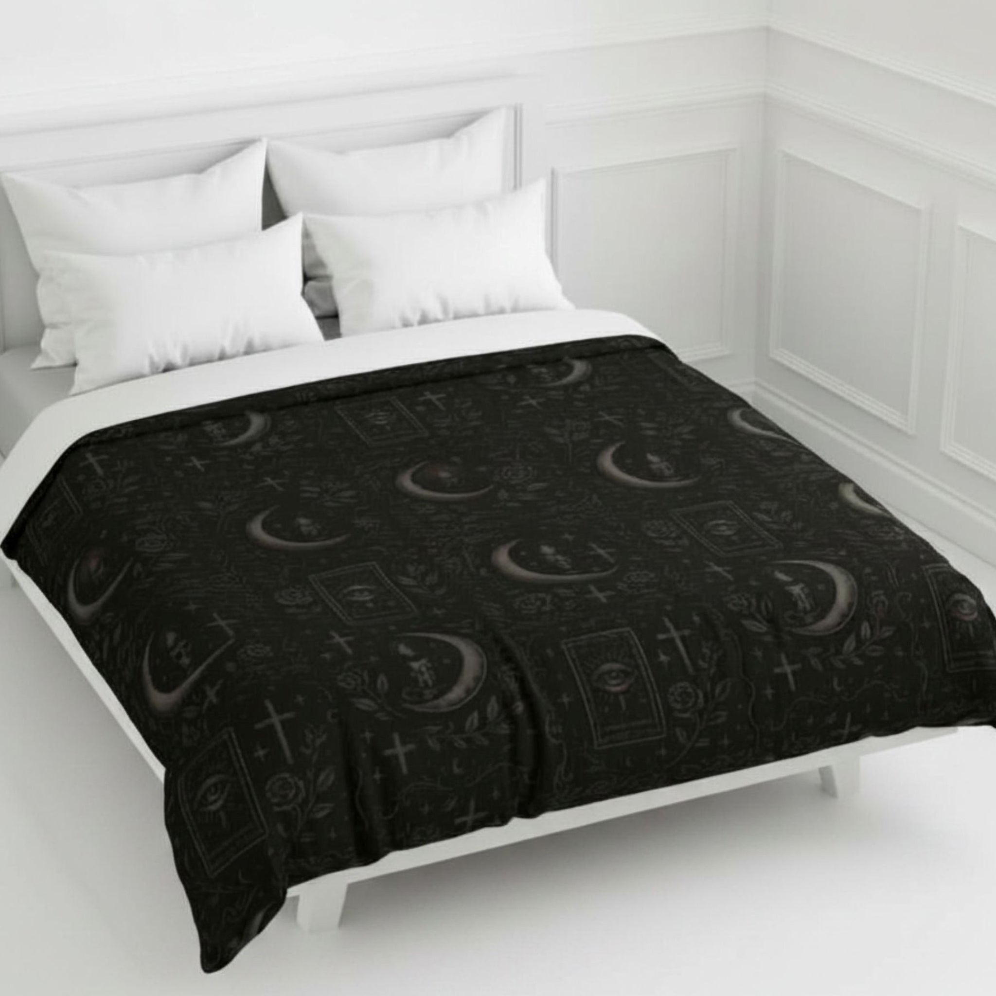 Gothic black duvet cover on a white bed.