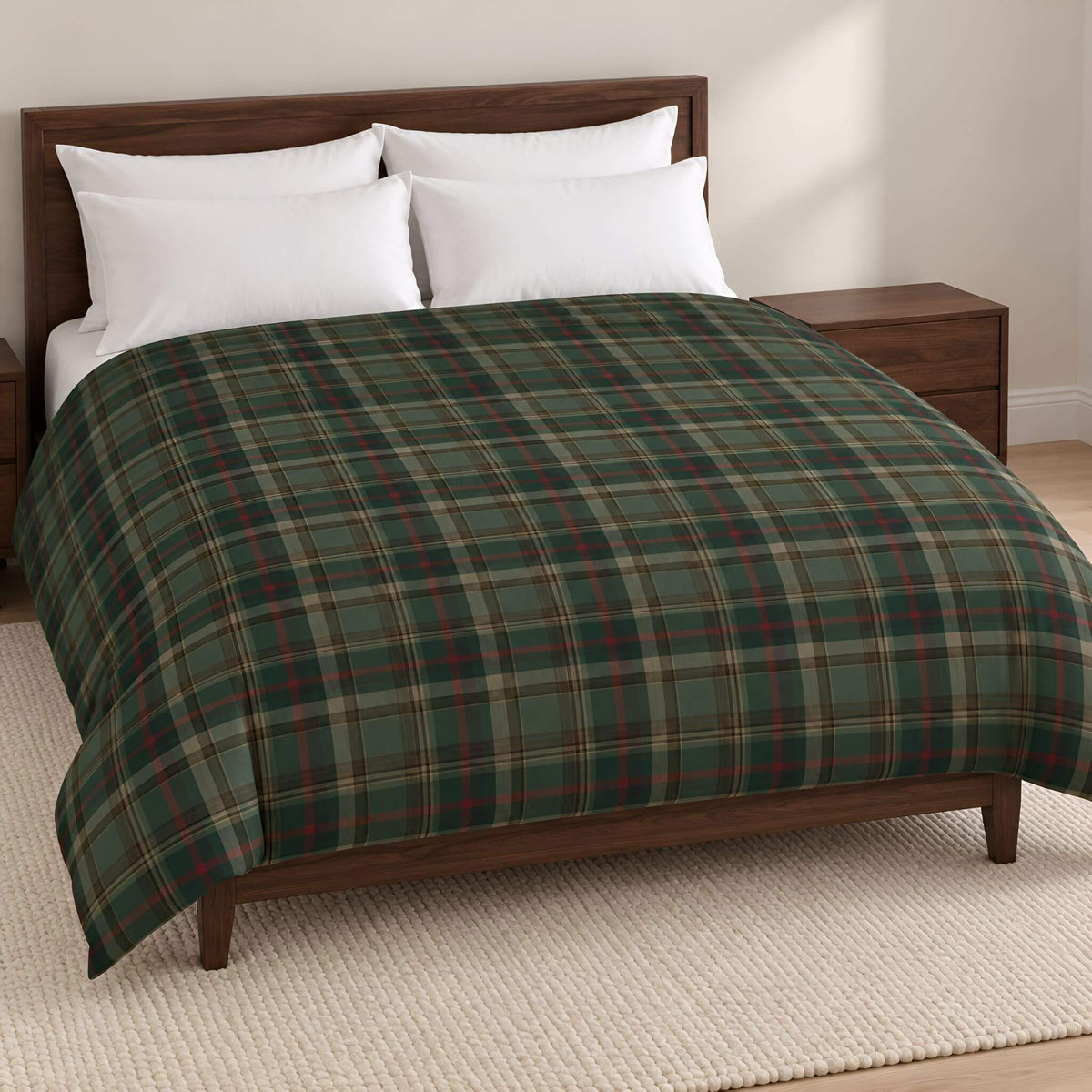 Cedar Ember green tartan plaid cotton duvet cover styled on a bed with white pillows and a dark wood headboard.