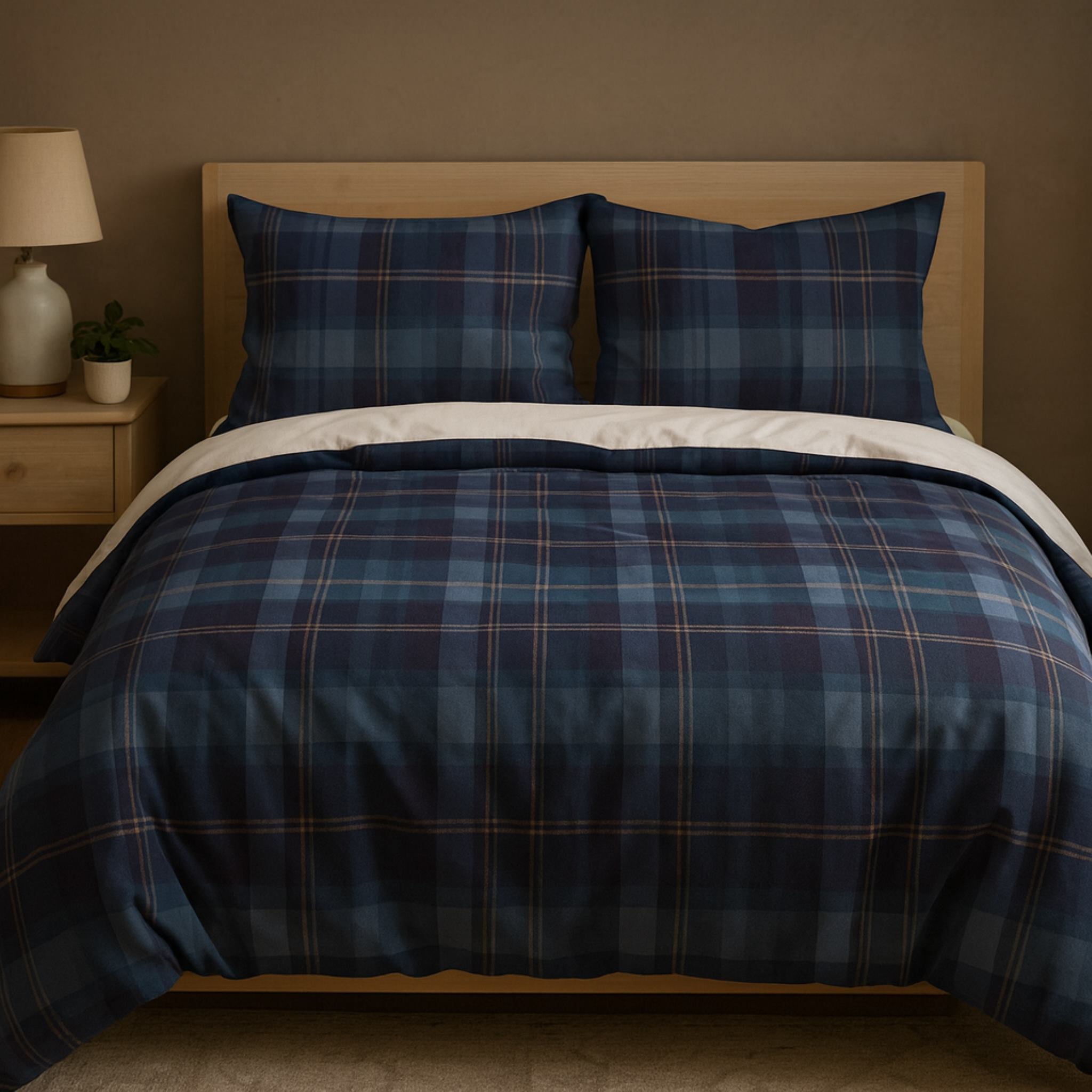 Bed with blue plaid bedding in a bedroom setting