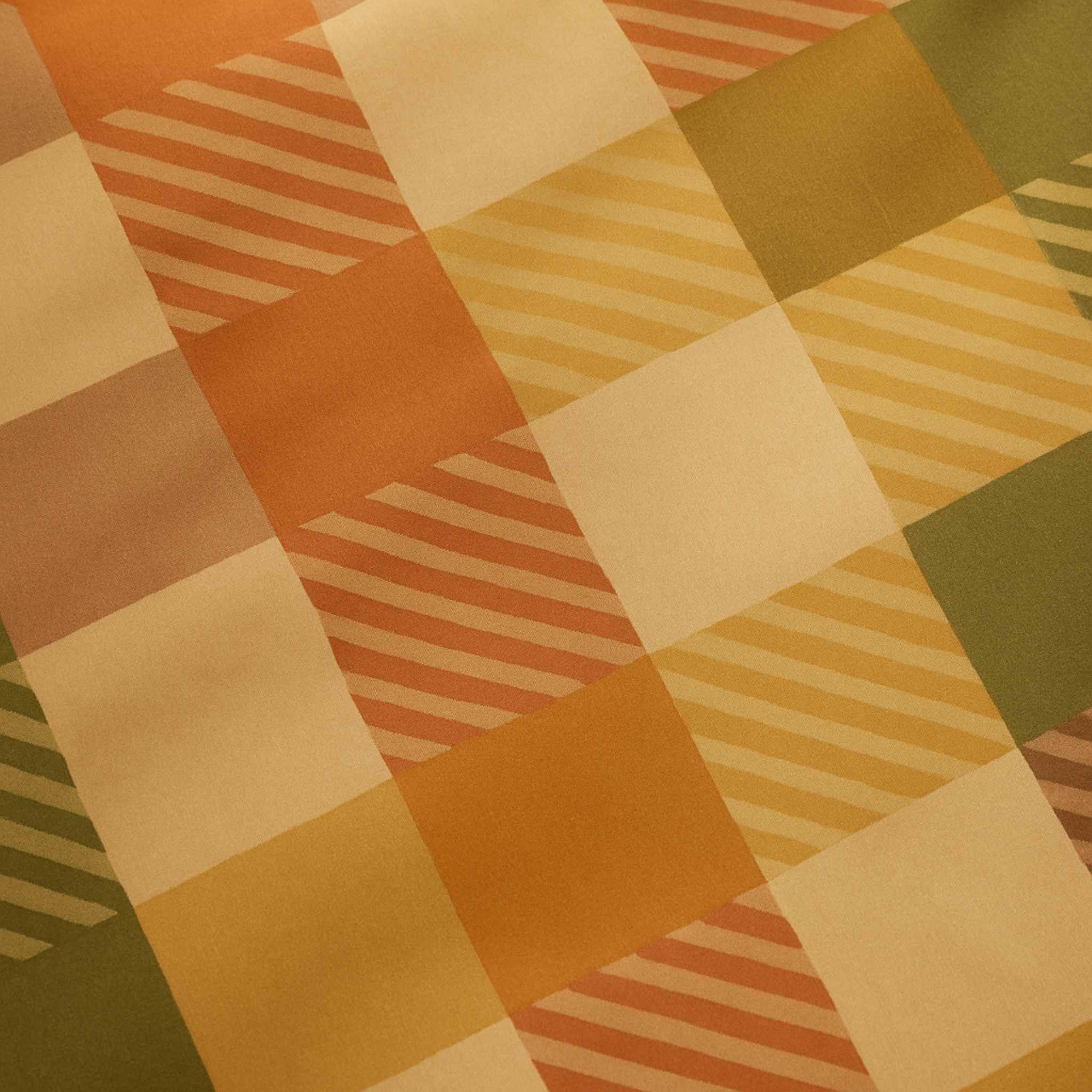Patterned fabric with a checkered design in orange, beige, and green.