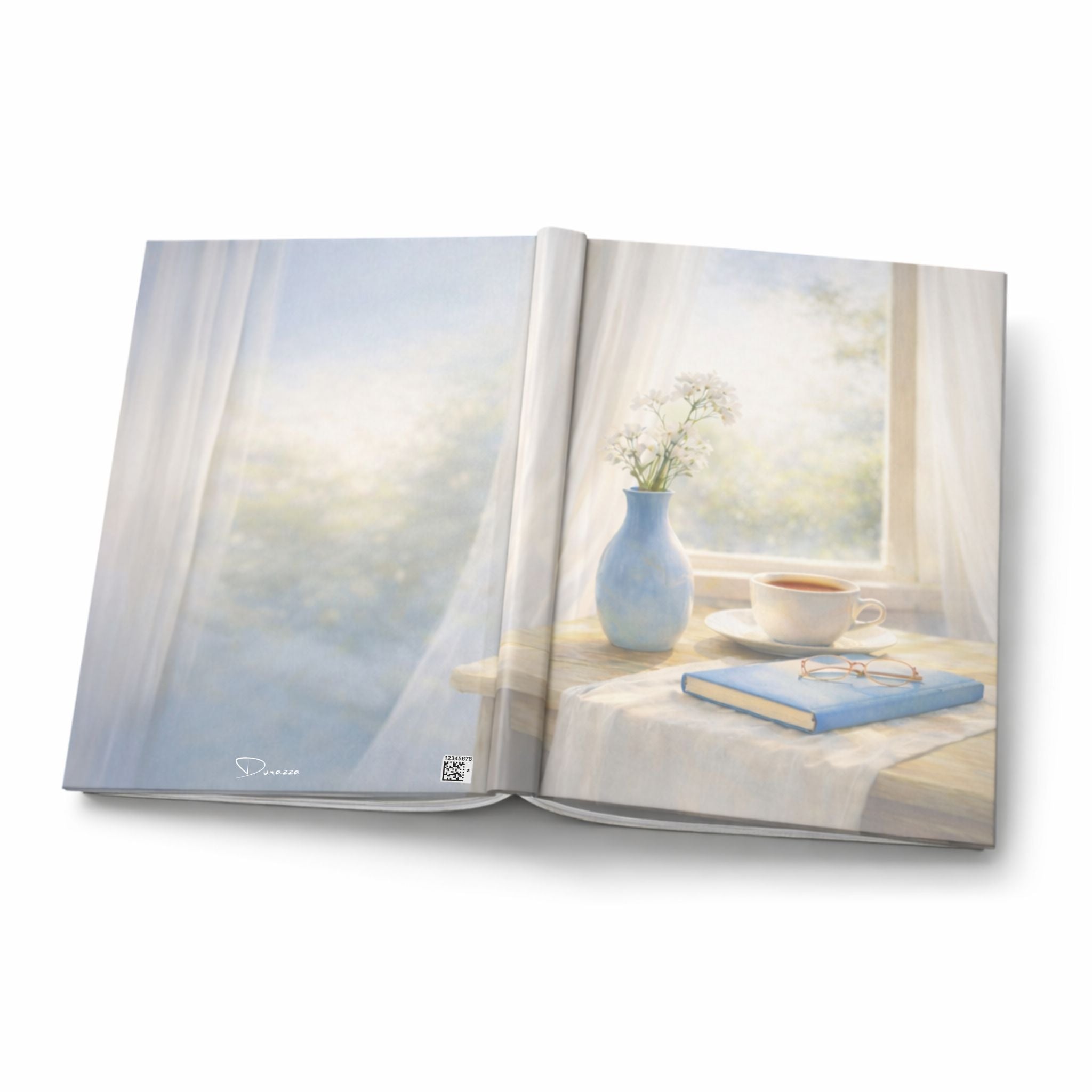 Open cottage styled journal showing a serene window scene with a vase, cup, and book on a table.