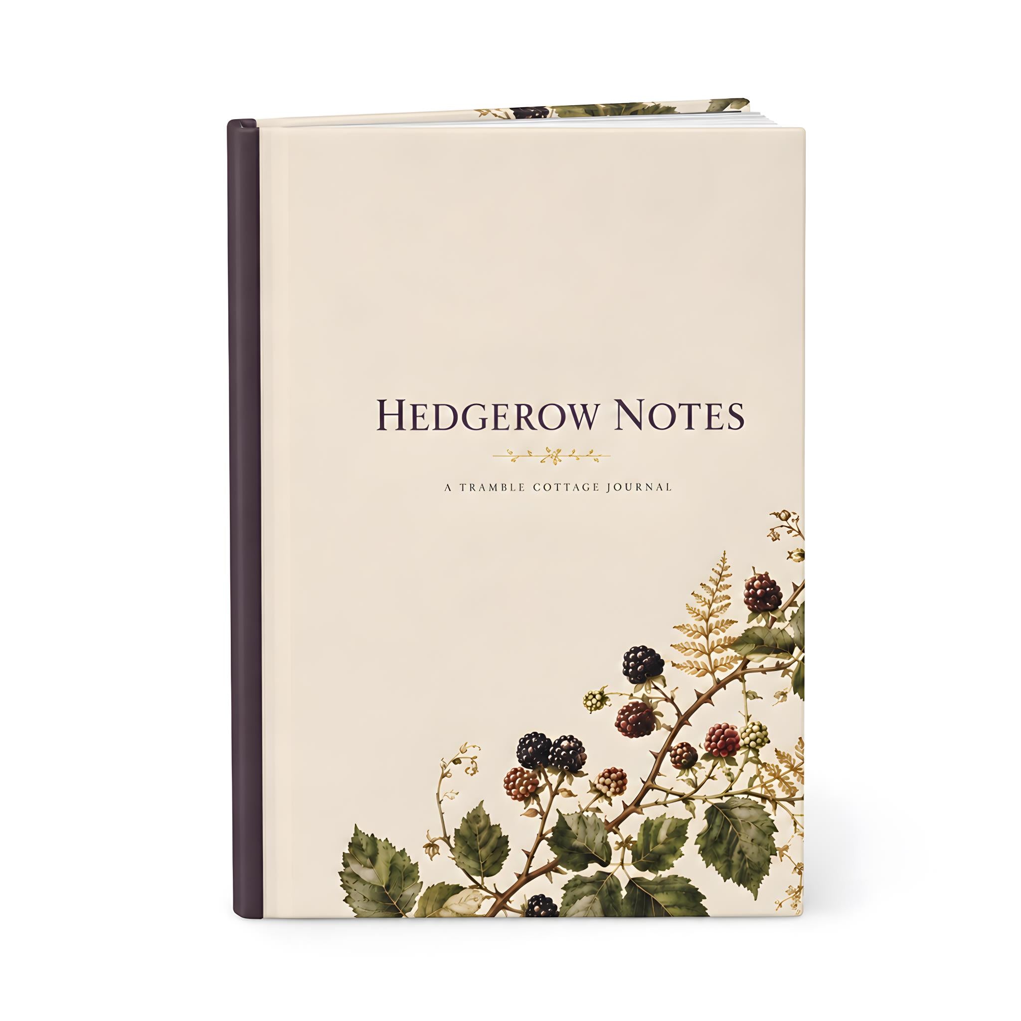 Hedgerow Notes cream hardcover journal with a deep plum spine and blackberry bramble artwork in olive, burgundy, and ochre.