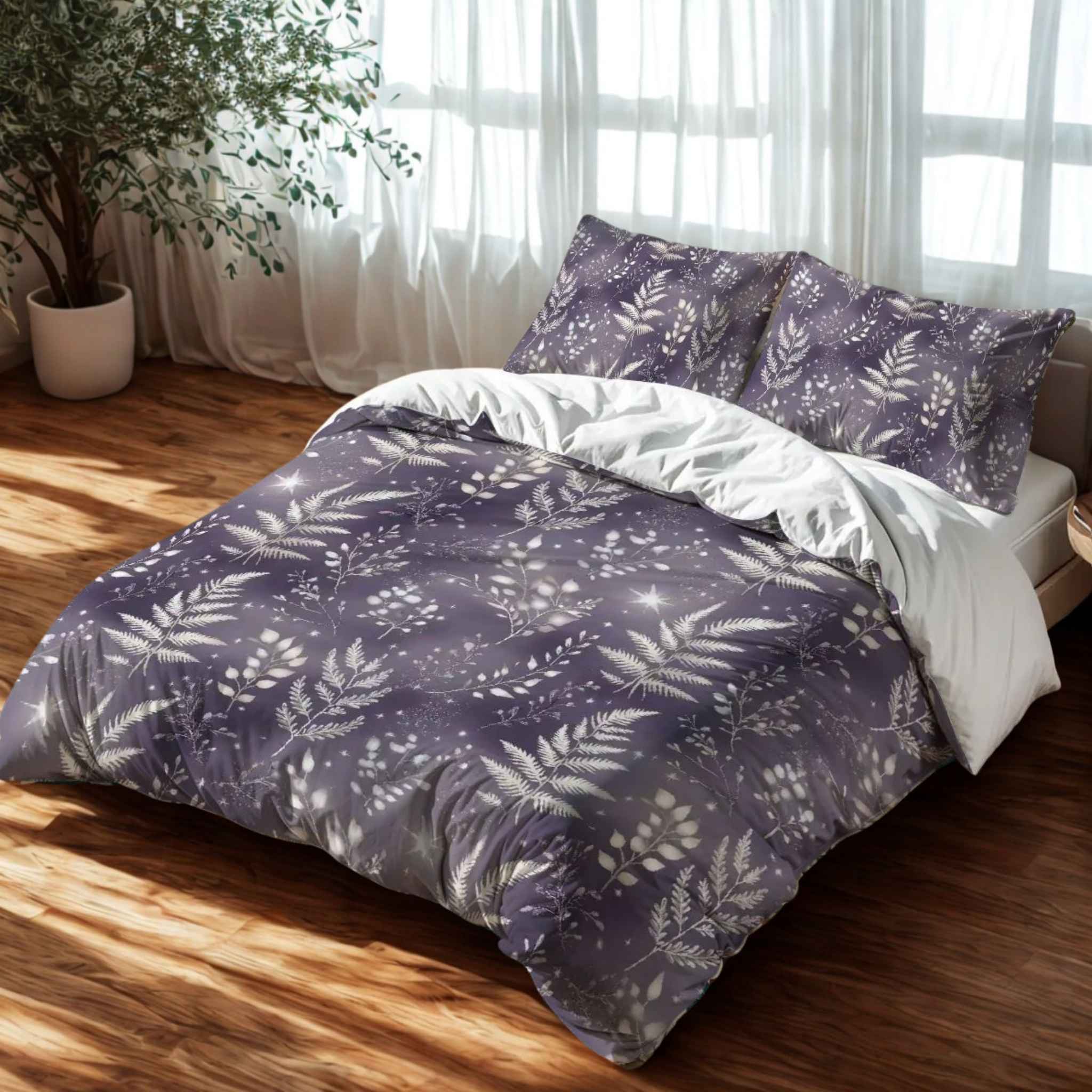 A duvet cover set with a purple and silver botanical pattern against a lavender background, displayed in a room setting with curtains and a plant.
