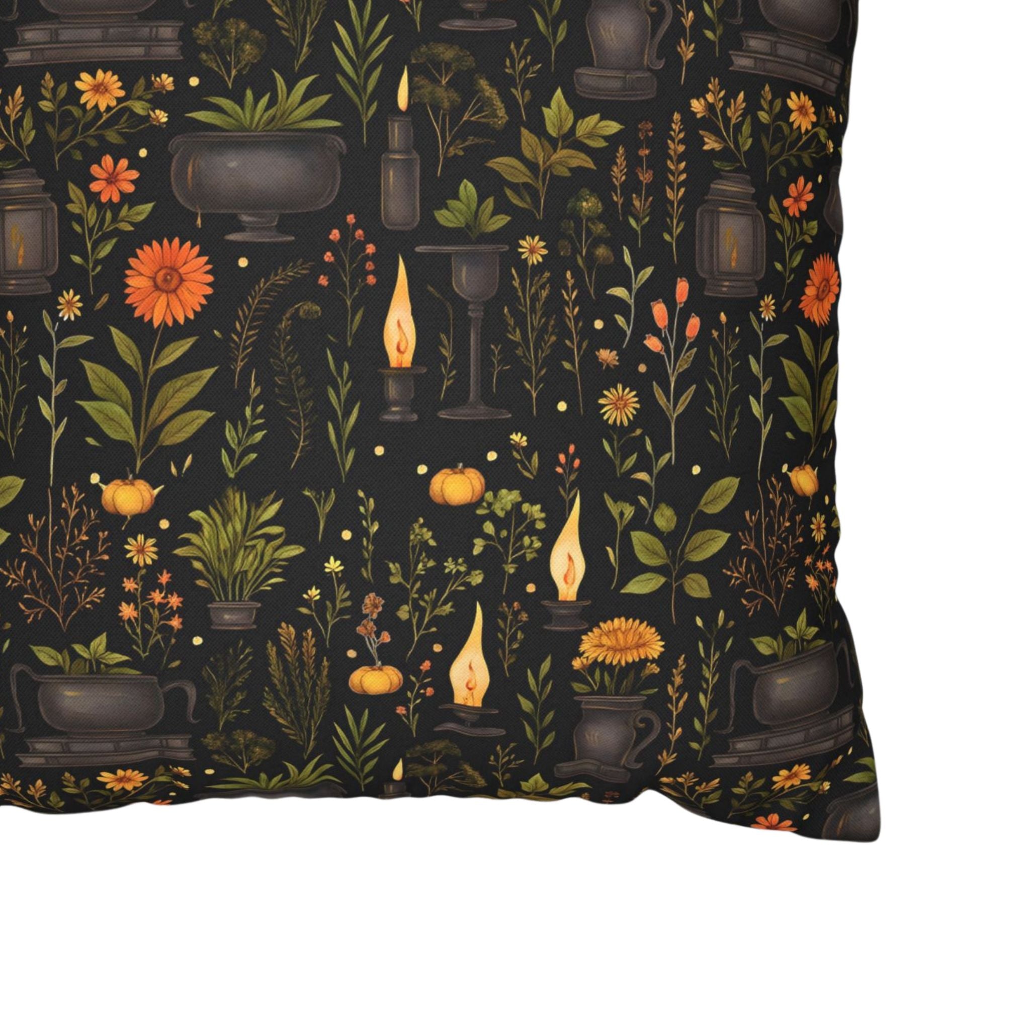 Close-up of apothecary pillow cover with herbs, candles, cauldrons, and florals.