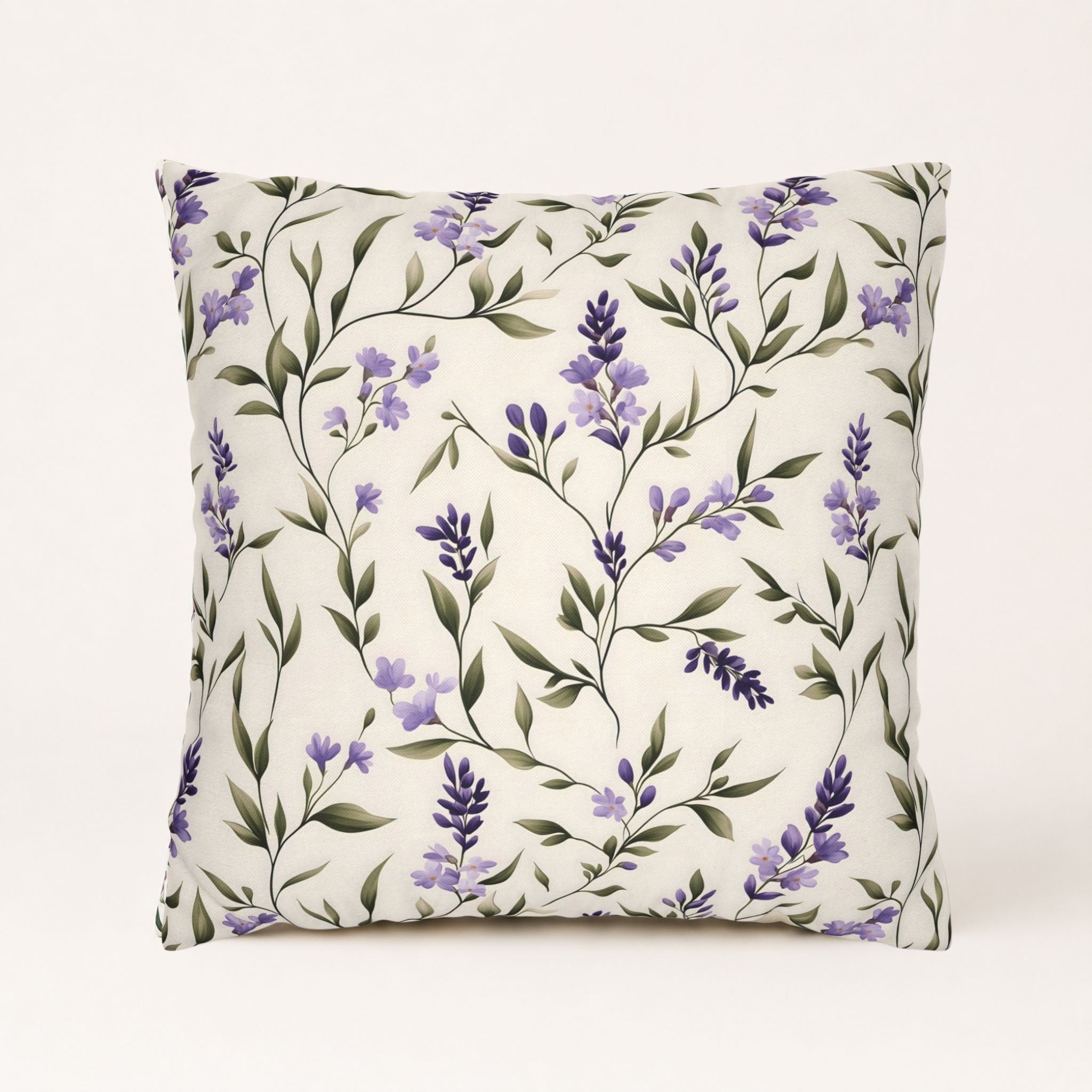 Delicate lavender floral throw pillow on an off white background.