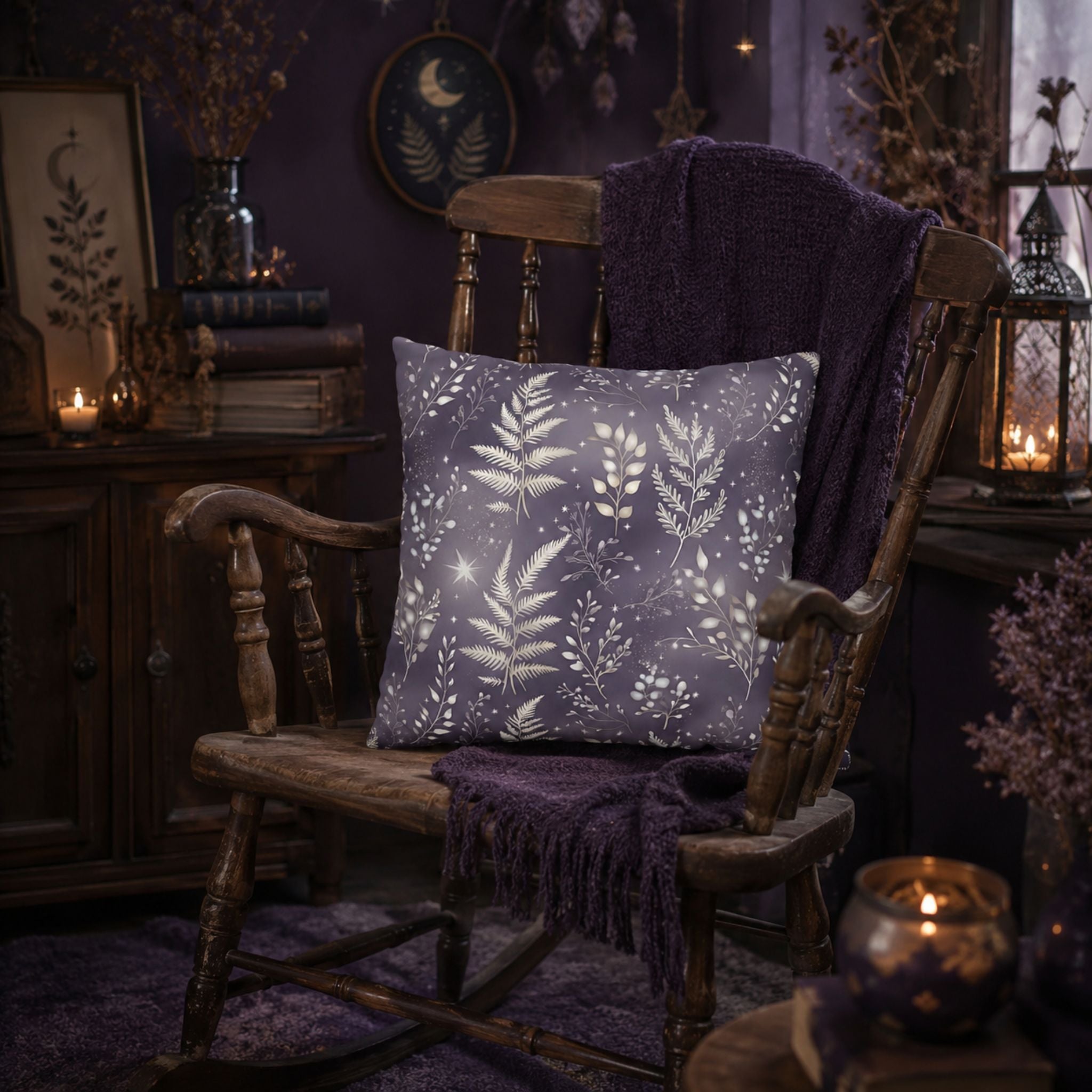 Decorative throw pillow with a fern leaf pattern on a wooden chair in a cozy, moody lit room.