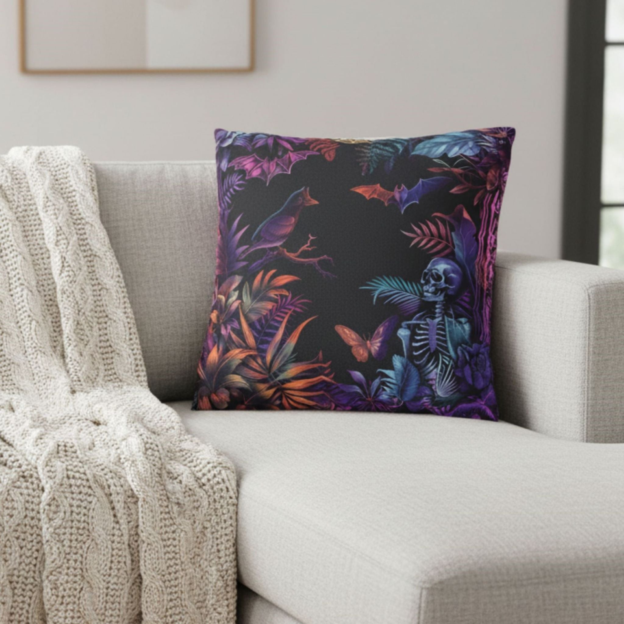 Decorative throw pillow cover with a colorful skeleton and leaf pattern on a gray sofa.