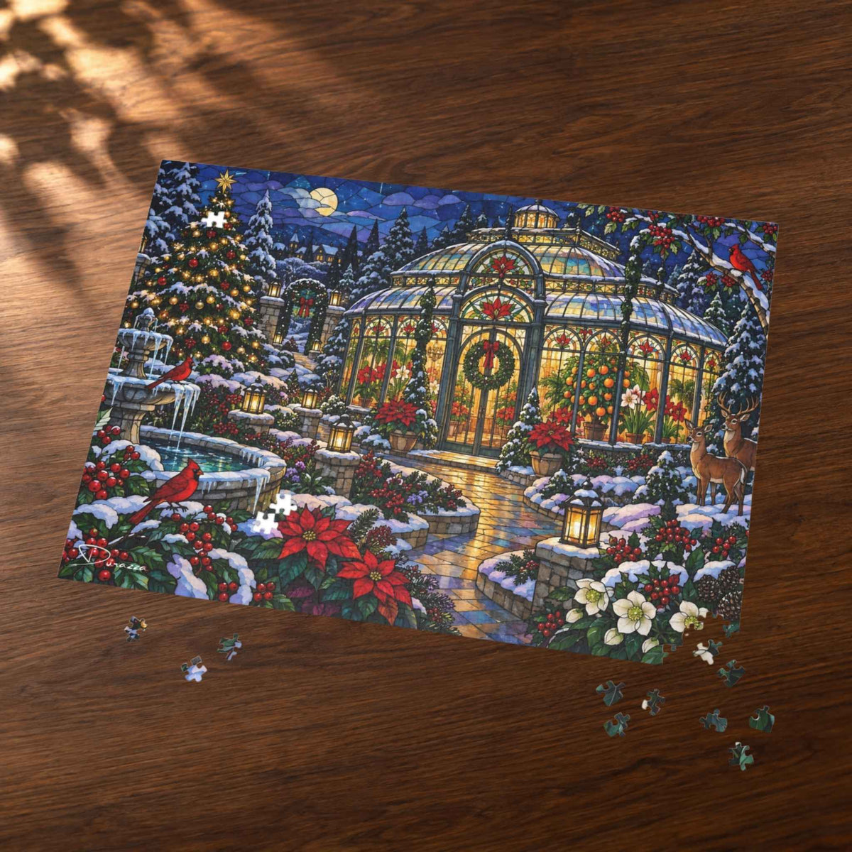 A completed jigsaw puzzle showing a festive winter garden scene with a glowing conservatory, snow-covered trees, poinsettias, and birds, placed on a wooden tabletop with a few loose puzzle pieces nearby.