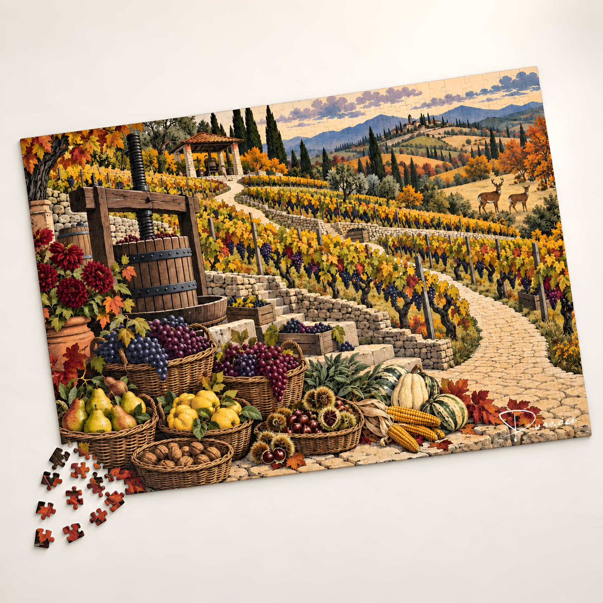 A completed autumn vineyard puzzle with loose puzzle pieces scattered at the lower left. The artwork depicts a stone path winding through colorful grapevines, baskets of grapes, pears, apples, and other fall produce, a wooden press, mountains, and a cloudy sky.