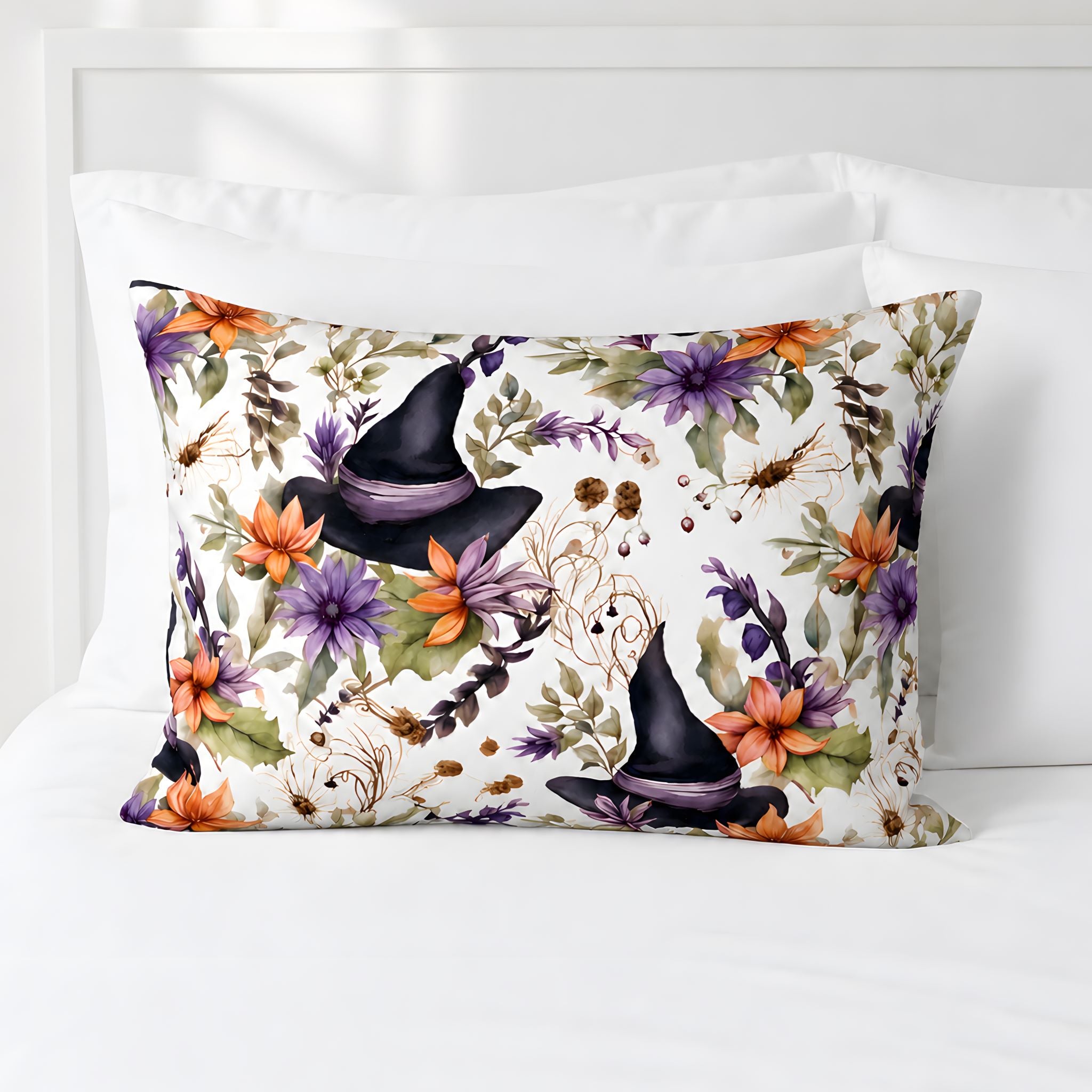 Botanical Halloween pillow sham with black witch hats, orange blooms, and sage leaves