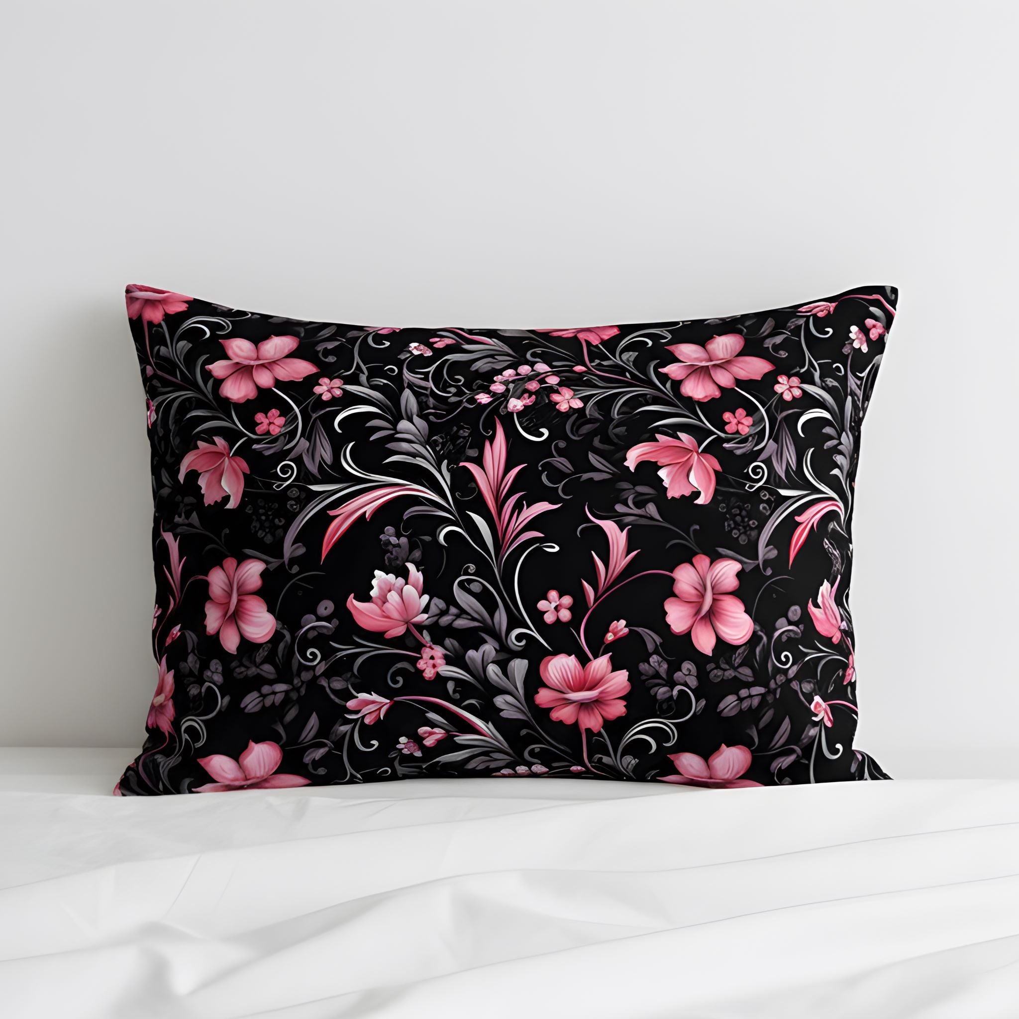 Black pillow sham with pink floral pattern.