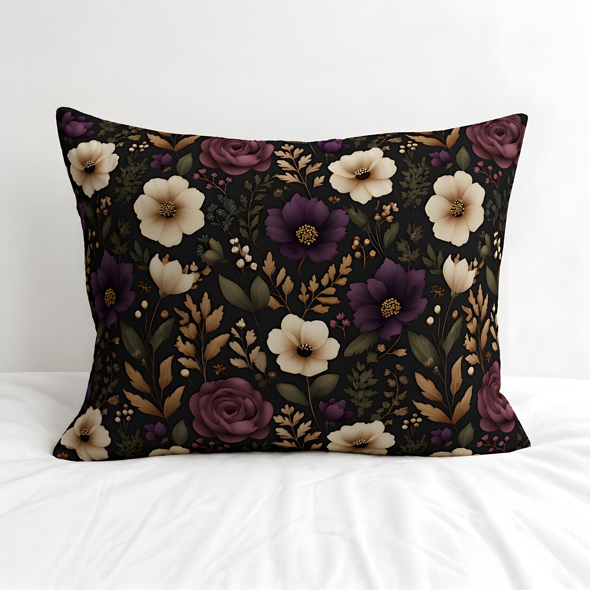 Floral cotton pillow sham on a white bed.