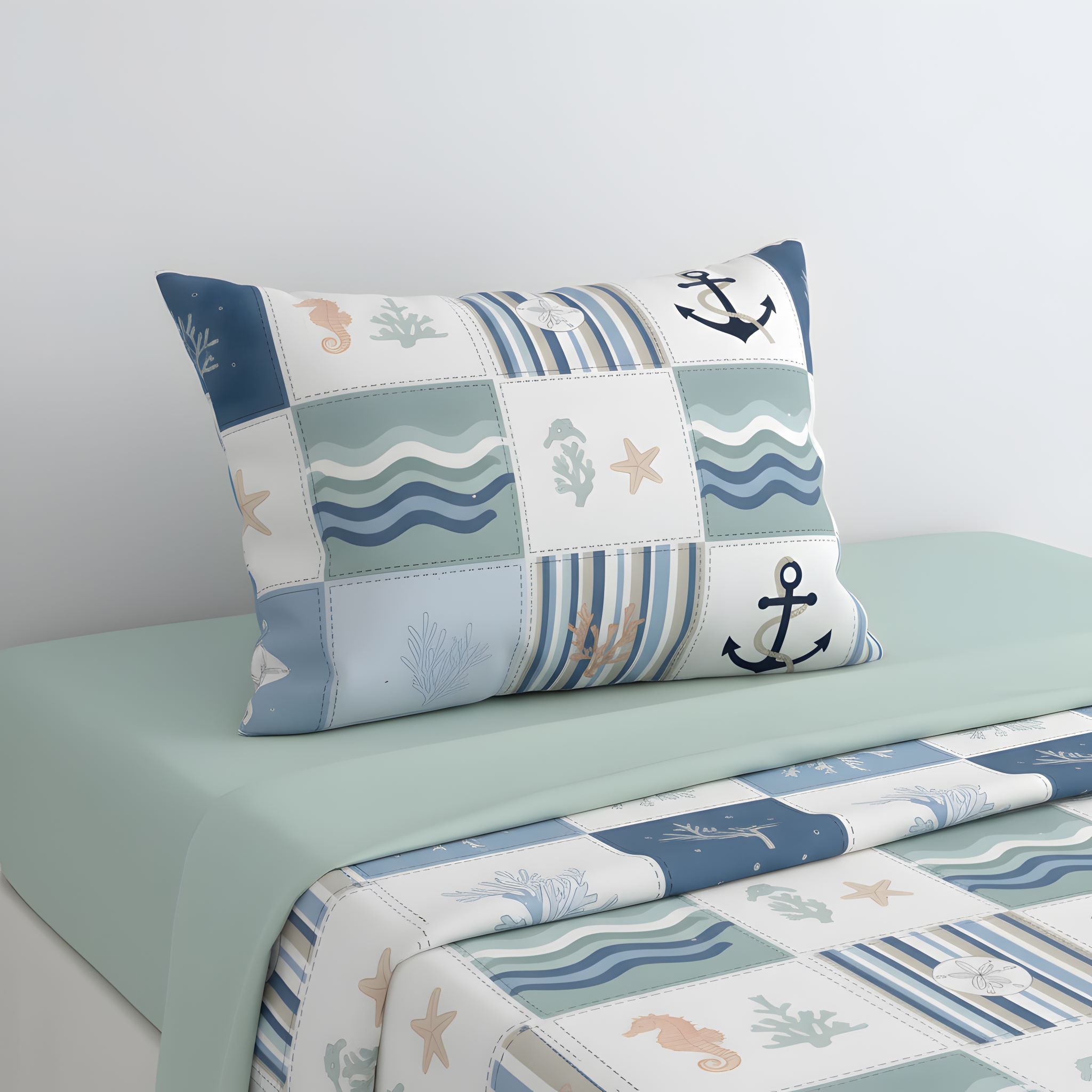 Beach patchwork pillow sham with nautical patterns on a bed with matching bedding.