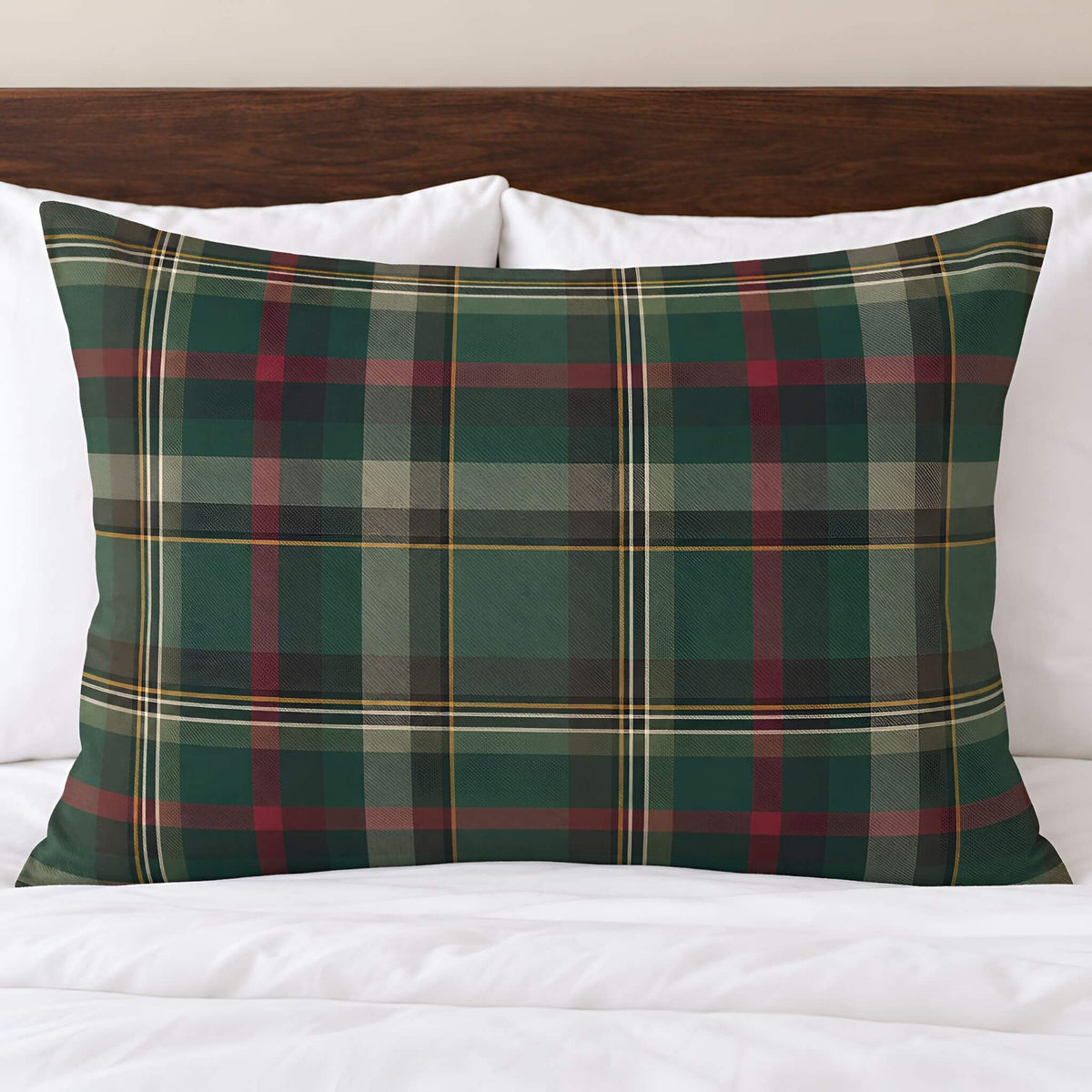 Cedar Ember green tartan plaid cotton pillow sham displayed against white pillows and bedding.