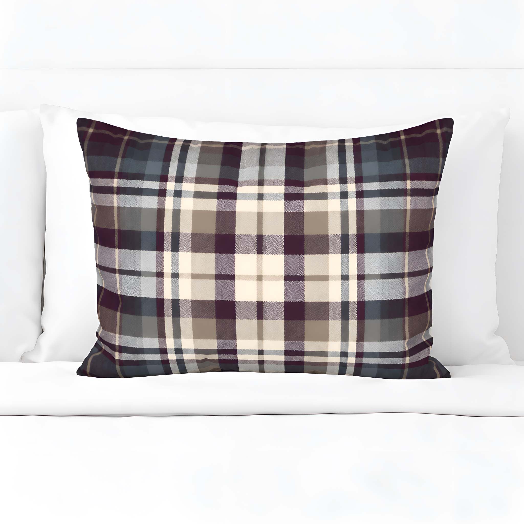 Highland Plum eggplant plaid cotton pillow sham displayed on white bedding.