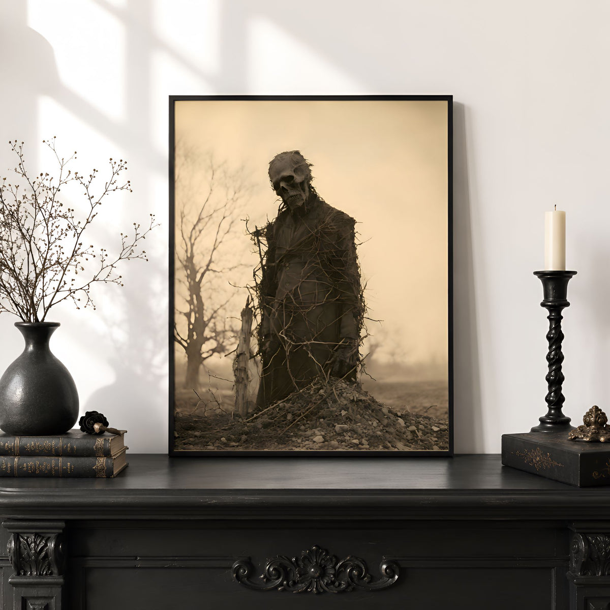 Victorian gothic framed artwork of a skeleton in a dark setting on a decorative shelf.