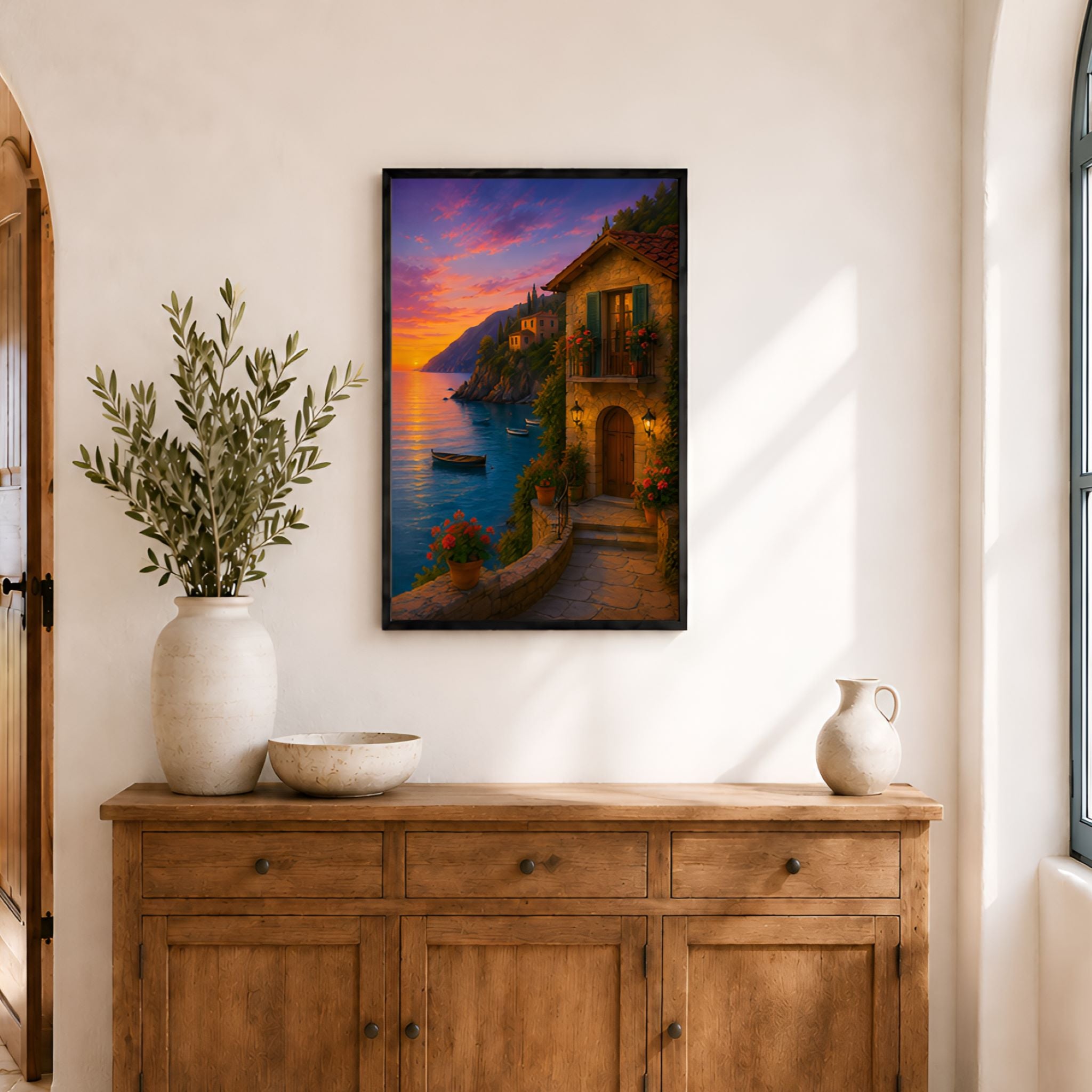 Framed Mediterranean villa wall art creating a colorful focal point in a bright coastal living space.
