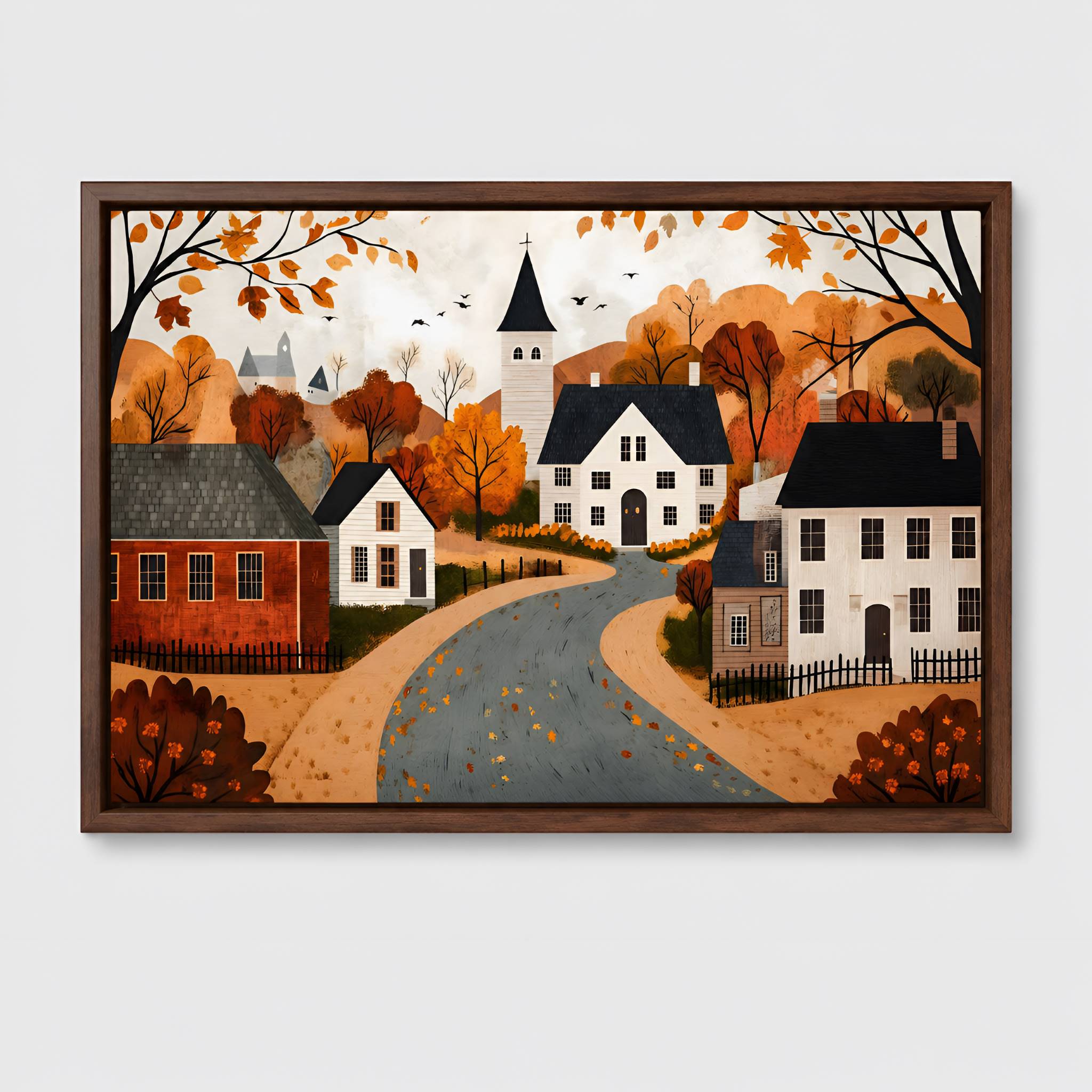 Framed artwork of a fall village scene with houses and trees on an autumn background.
