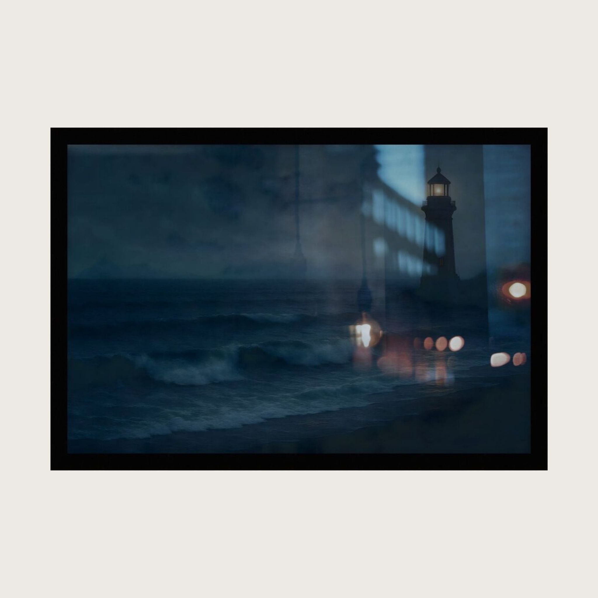 Framed artwork of a lighthouse at night with waves and lights.