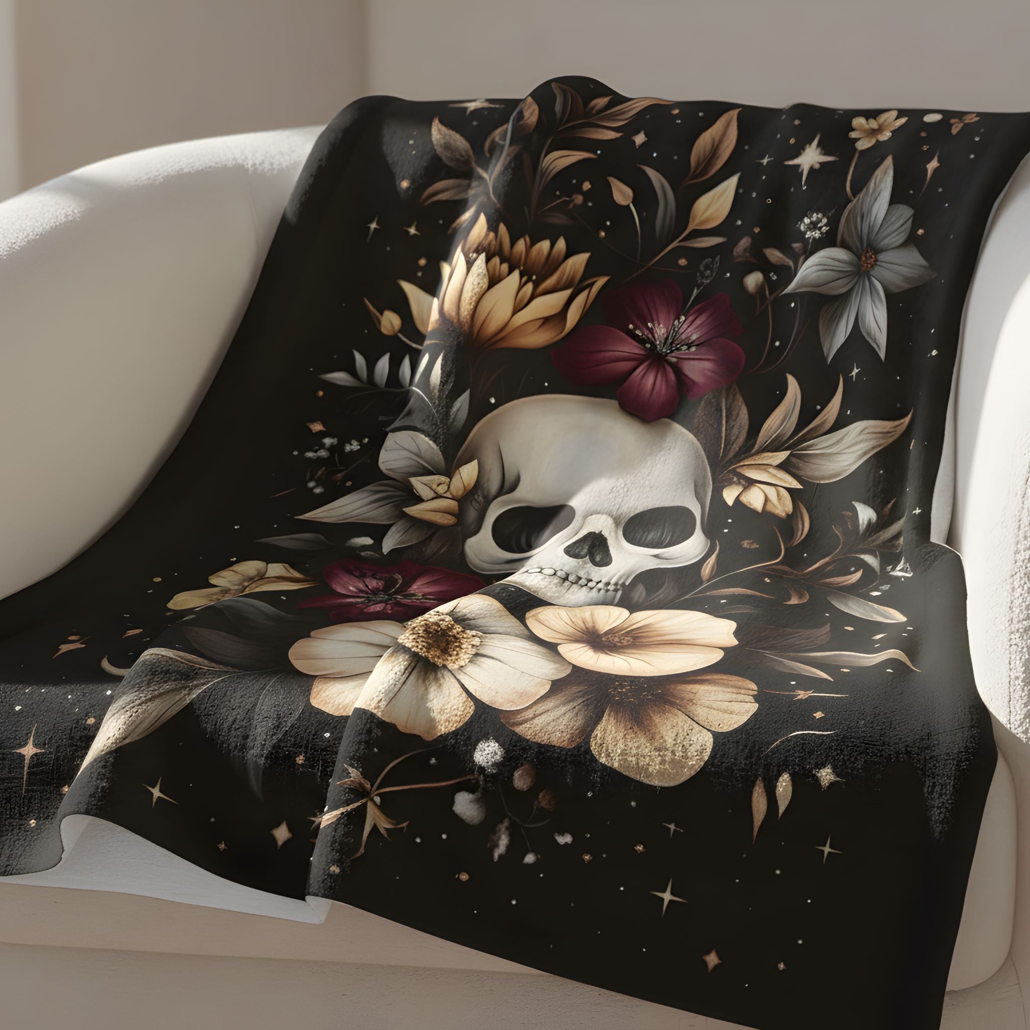 Moody botanical velveteen throw blanket with skull, soft beige flowers, plum blooms, and star details.