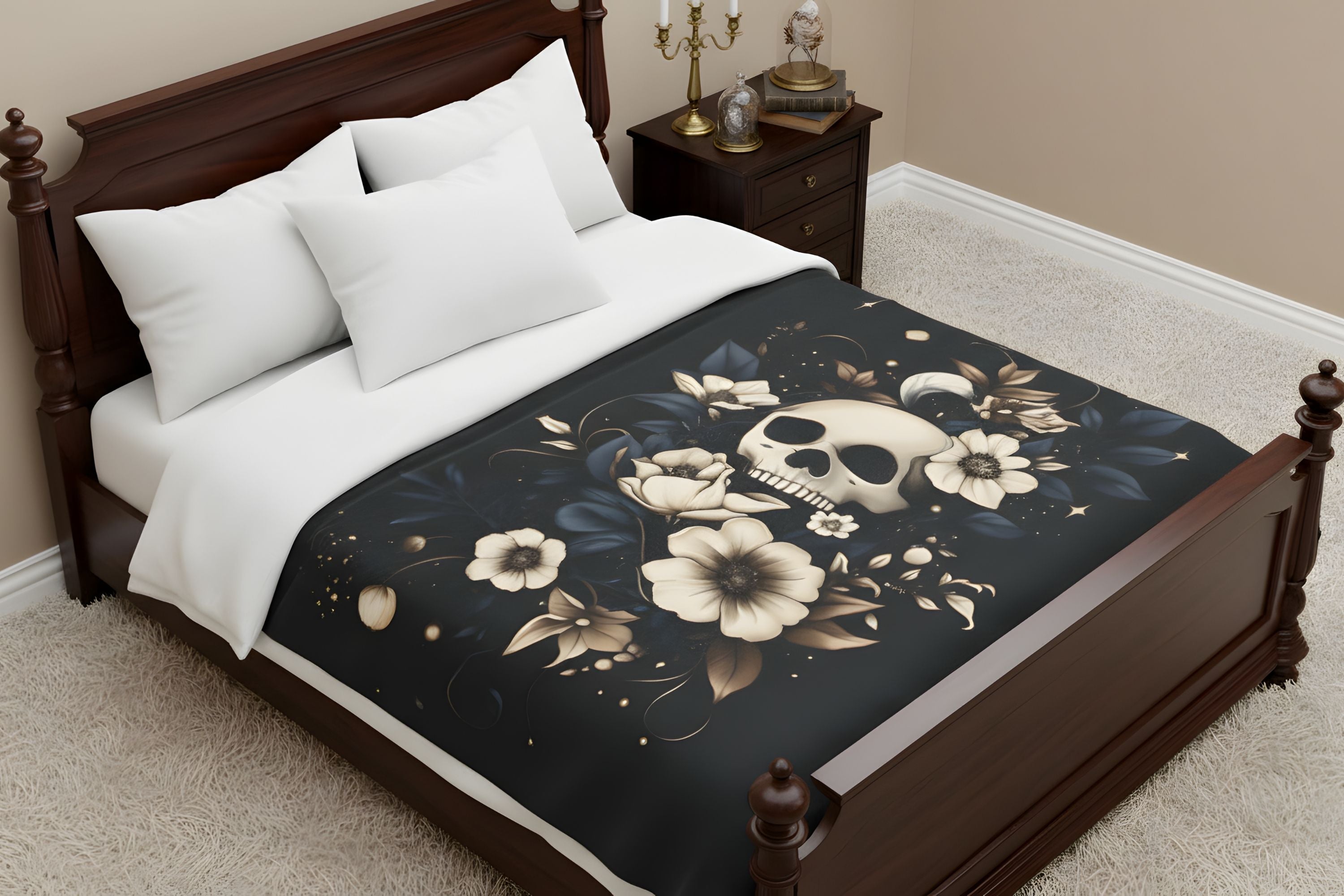 Moody botanical velveteen throw blanket on bed with skull artwork, cream flowers, and deep blue leaves.