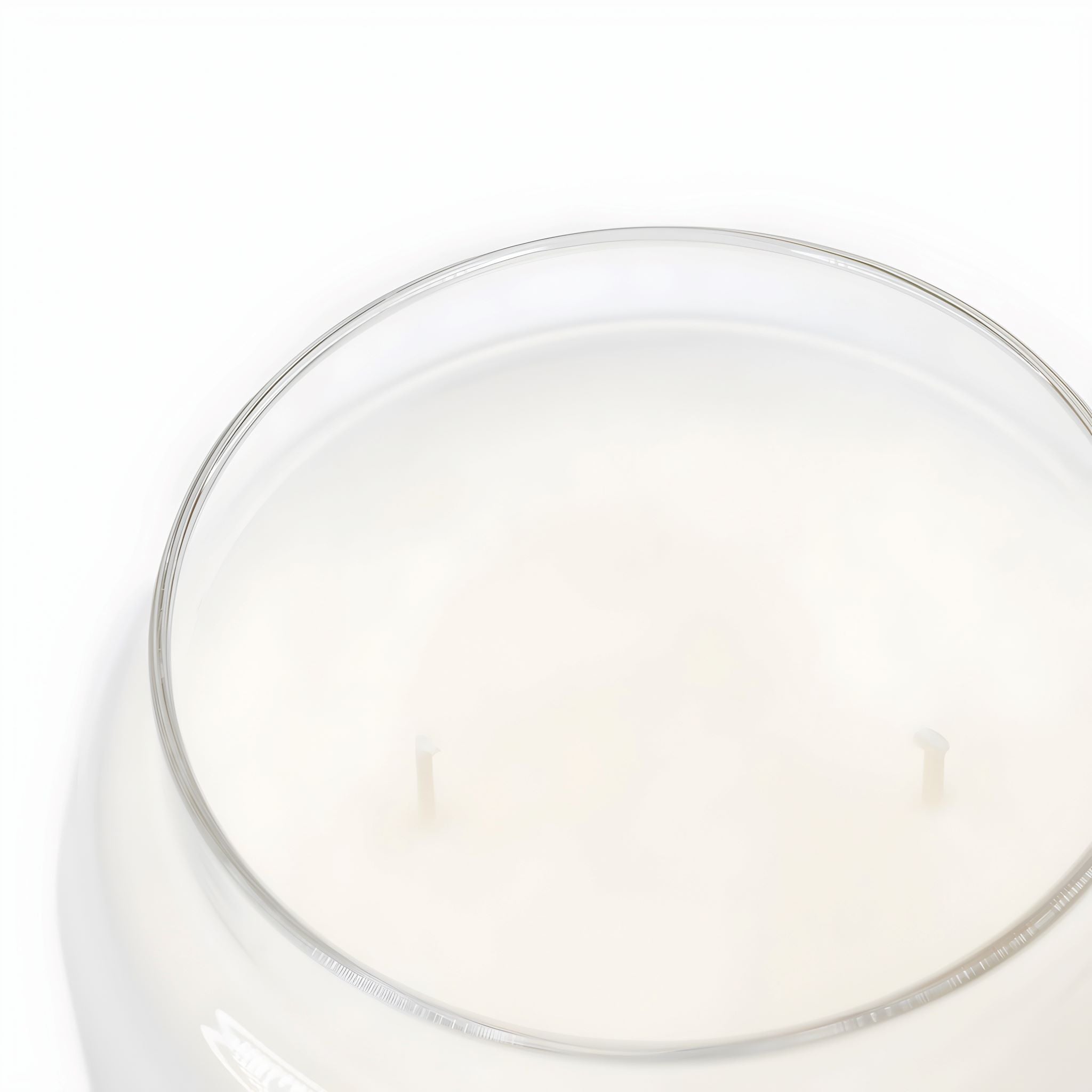 Closeup of Durazza's double wick scented candle with coconut apricot wax blend.