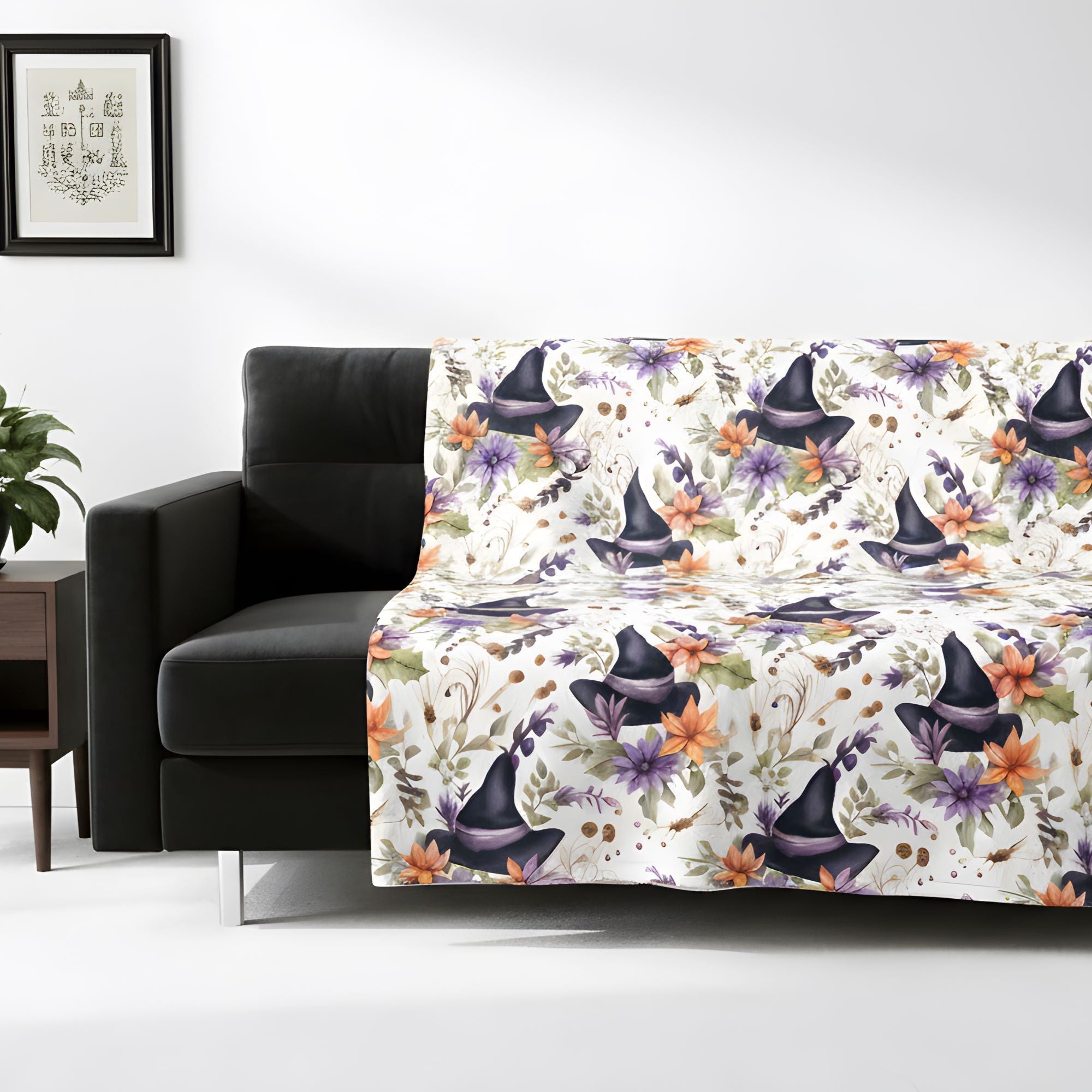 Halloween-inspired witch hat blanket displayed over a black sofa in a bright room.