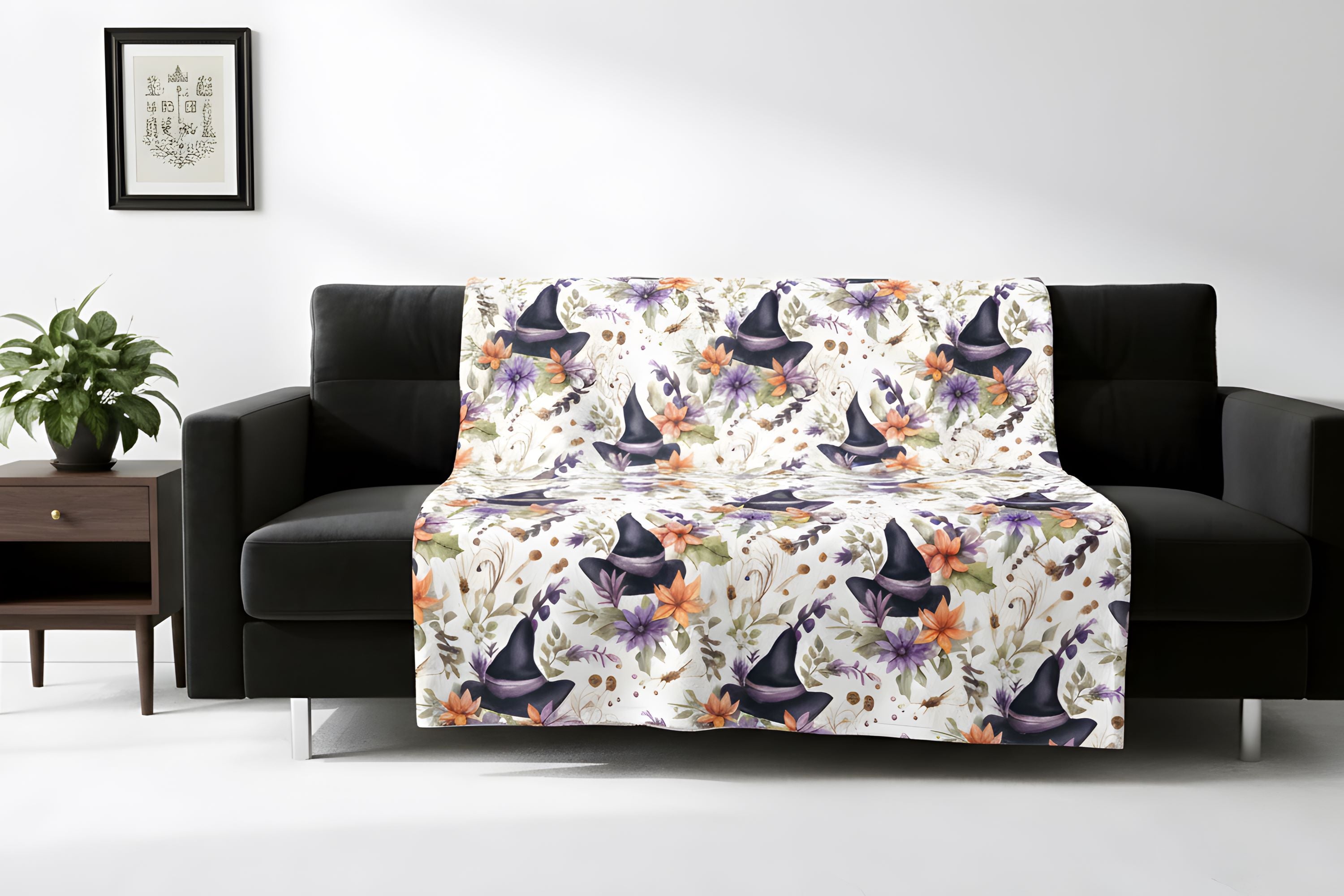 Halloween-inspired witch hat blanket displayed over a black sofa in a bright room.
