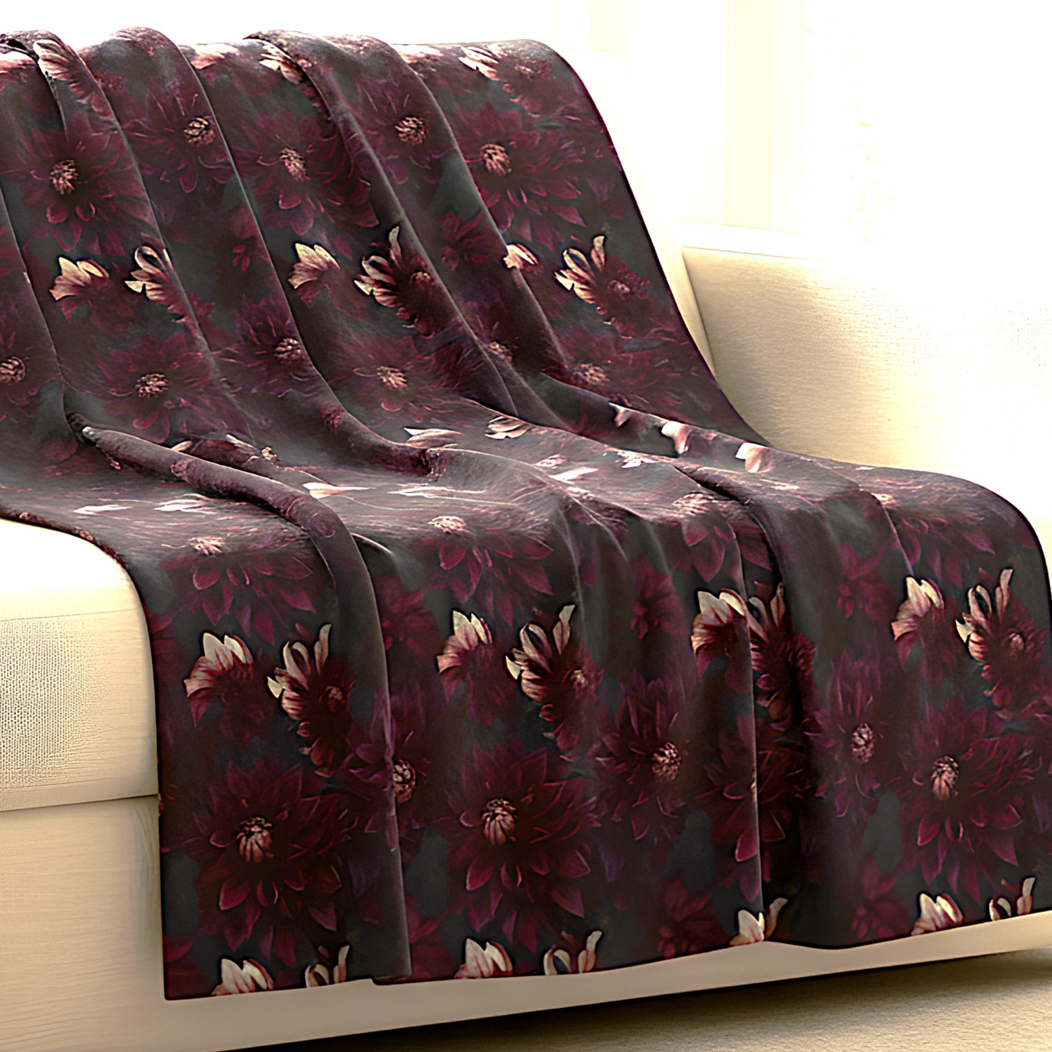 Plum floral throw blanket draped over a sofa.