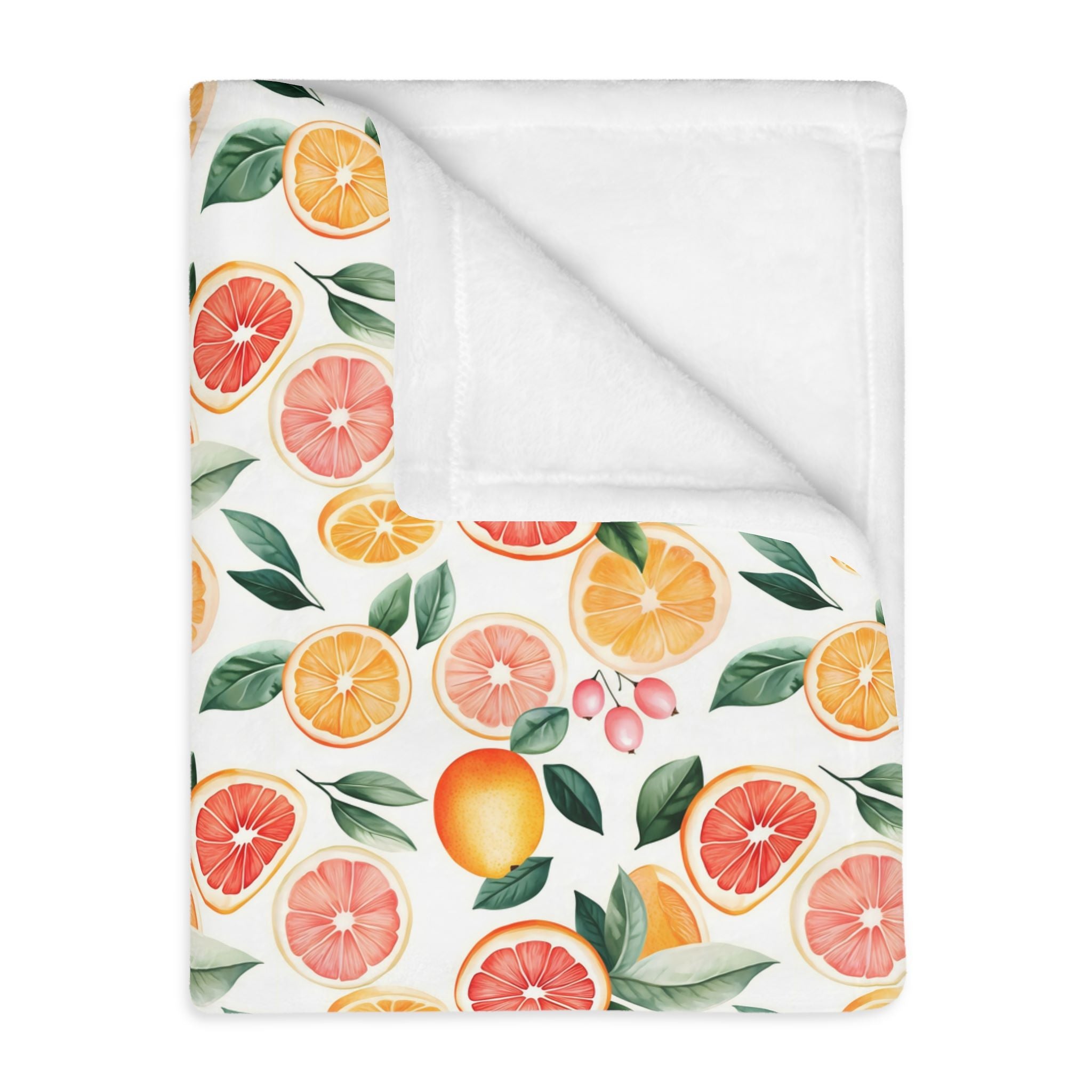 A citrus grove throw blanket with a pink grapefruit pattern in a velveteen fabric.