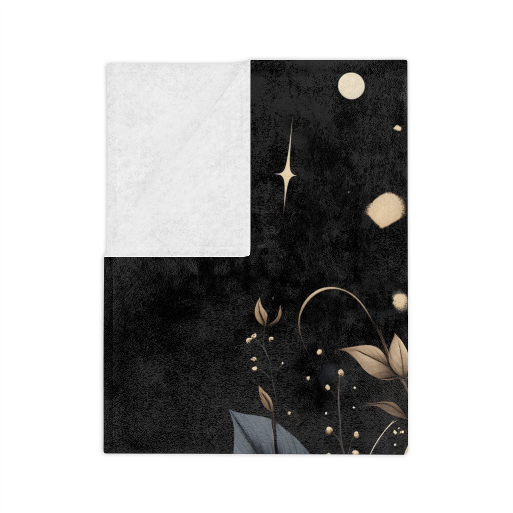 Folded Dark floral velveteen throw blanket showing white underside.