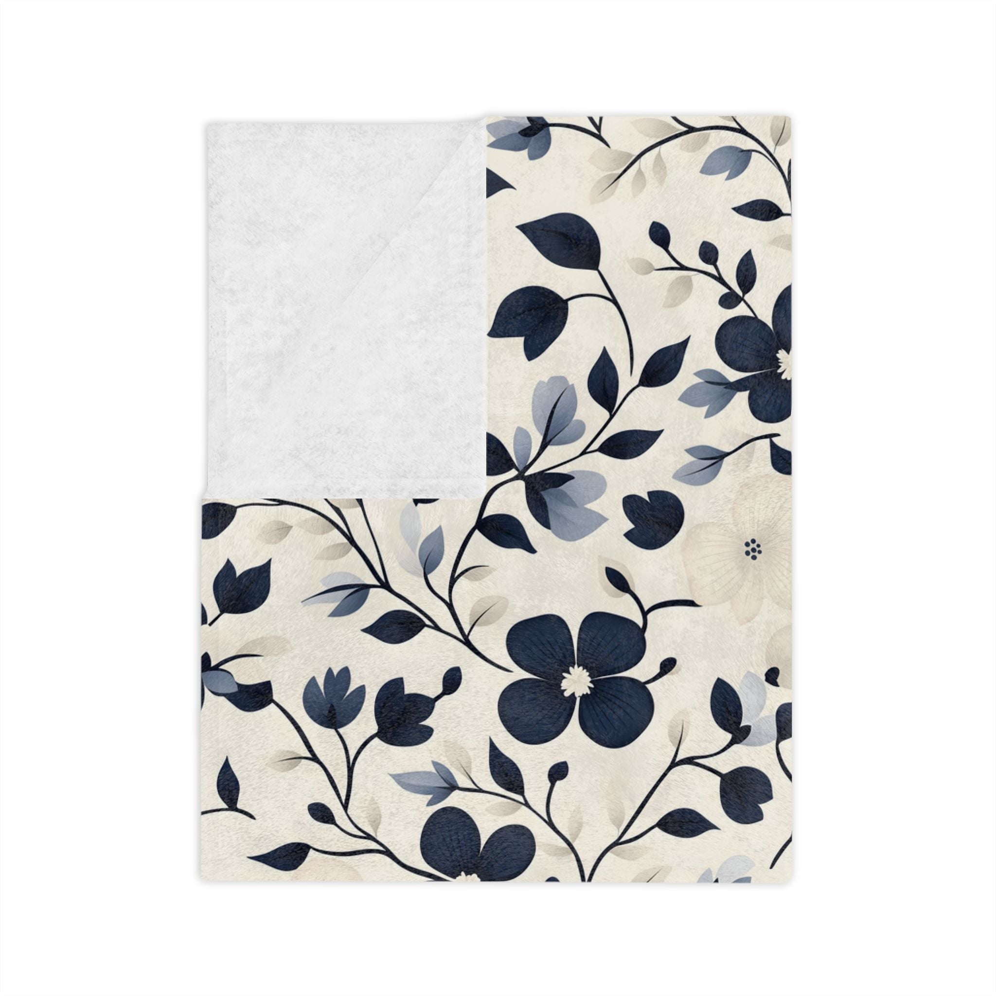 Folded navy floral throw blanket in velveteen with ivory background and Chateaucore cottage pattern