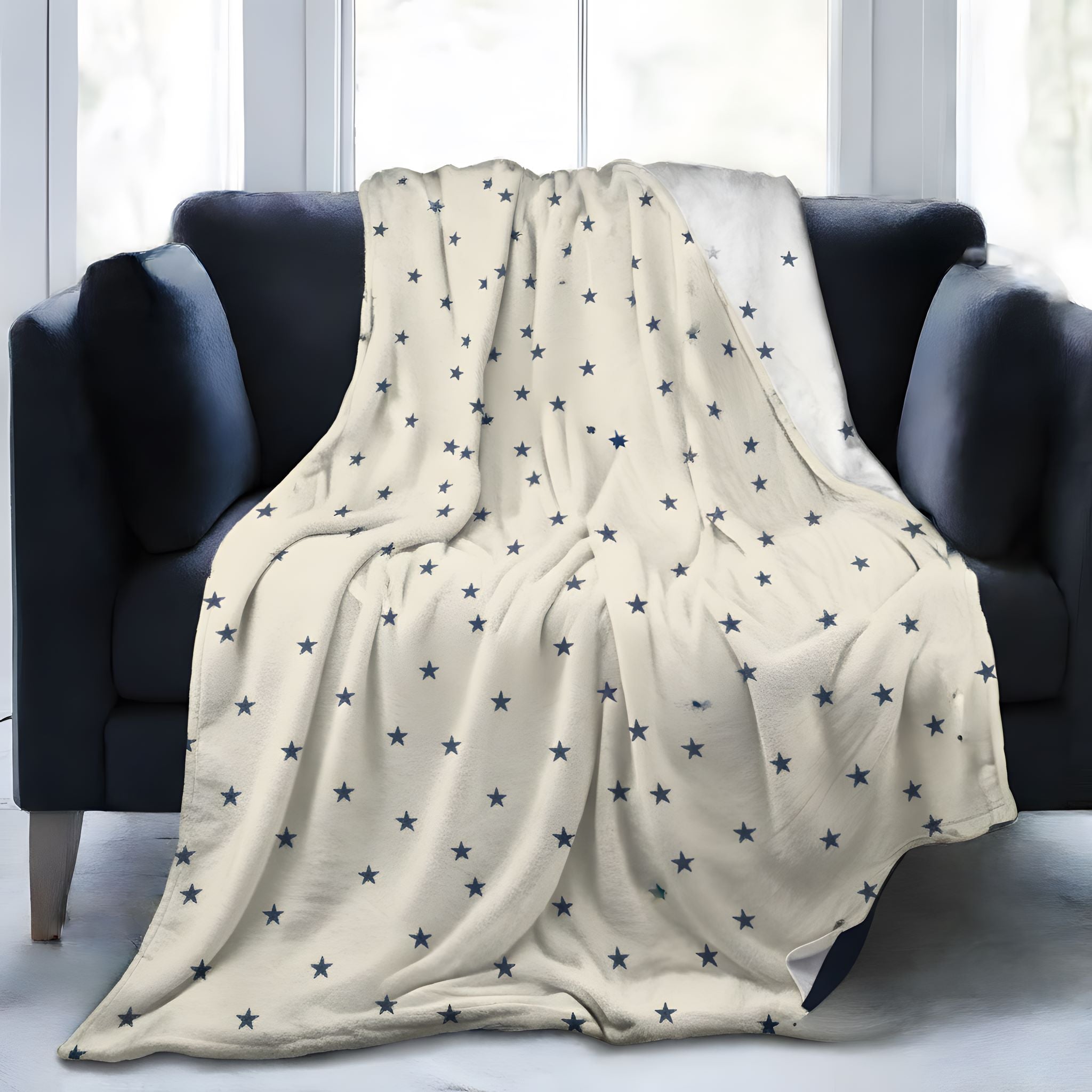 Celestial star throw blanket draped over a navy armchair in a moody room