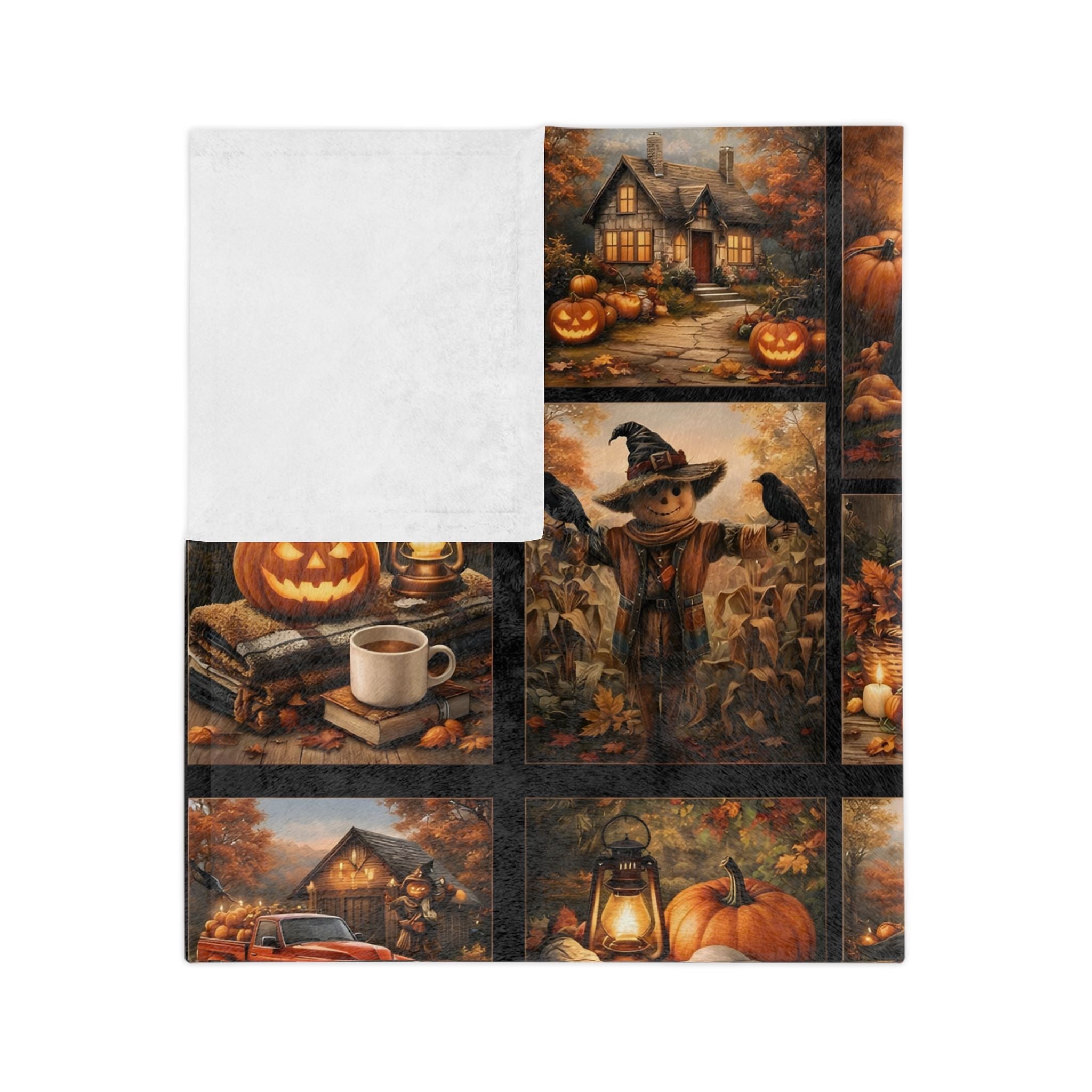 Folded Halloween throw blanket showing white underside and Halloween pattern on topside.